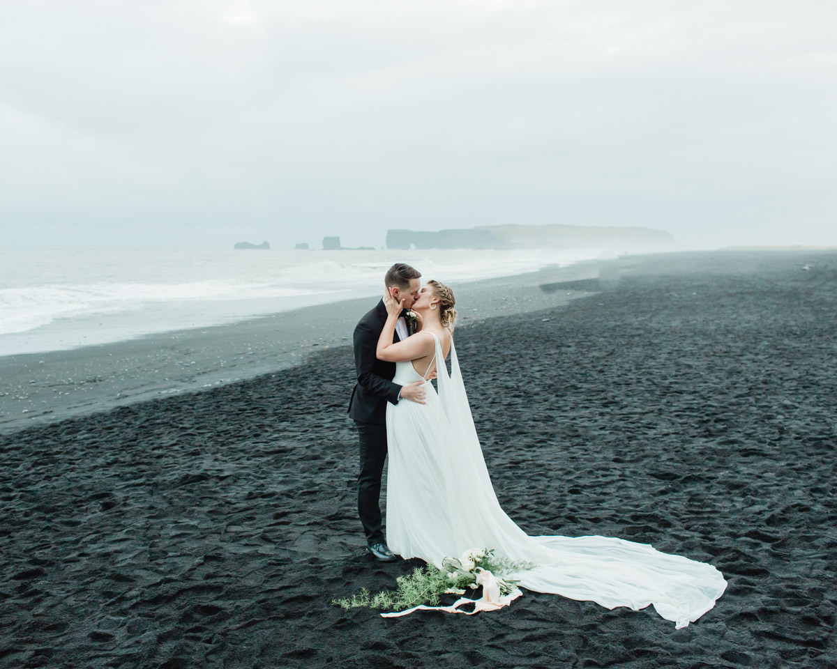 Michael and Nicole love it up on the beach during their Iceland elopement 