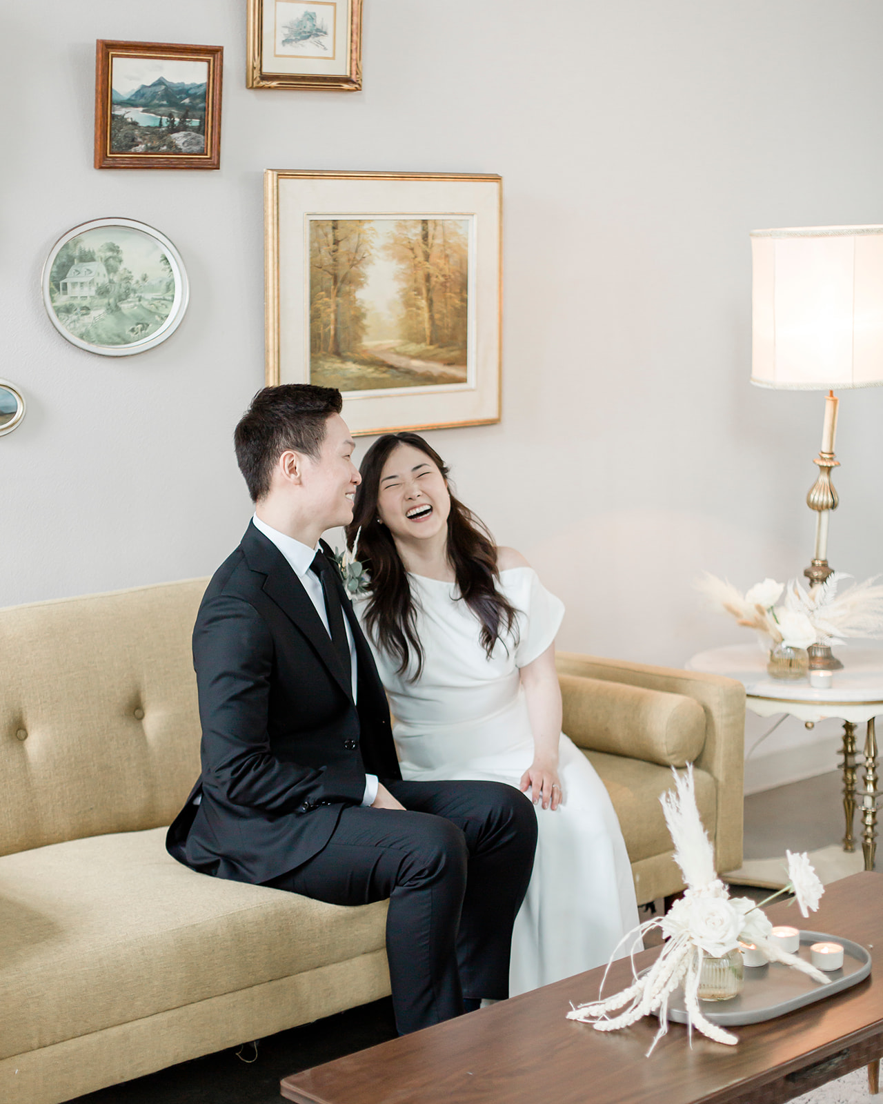 A portrait of a bride and groom at their airbnb laughing and having a great time before eloping in Ontario 