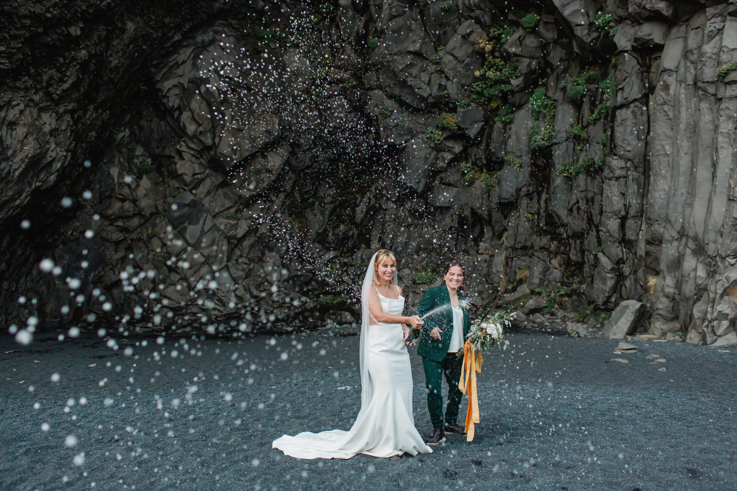 A couple celebrates their Iceland elopement with bubbly and laughs.