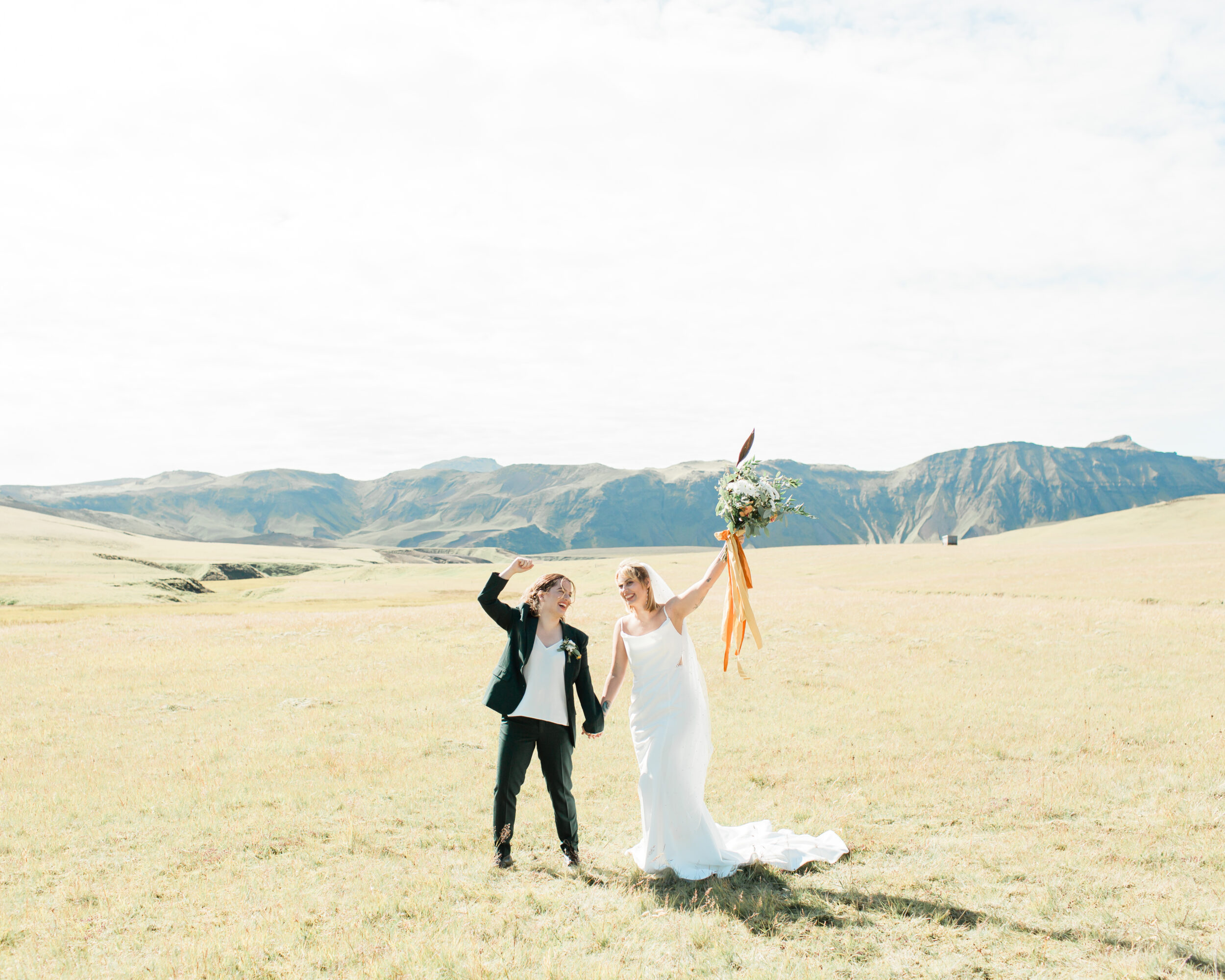A woman and her wife admire one another and celebrate their Iceland elopement.