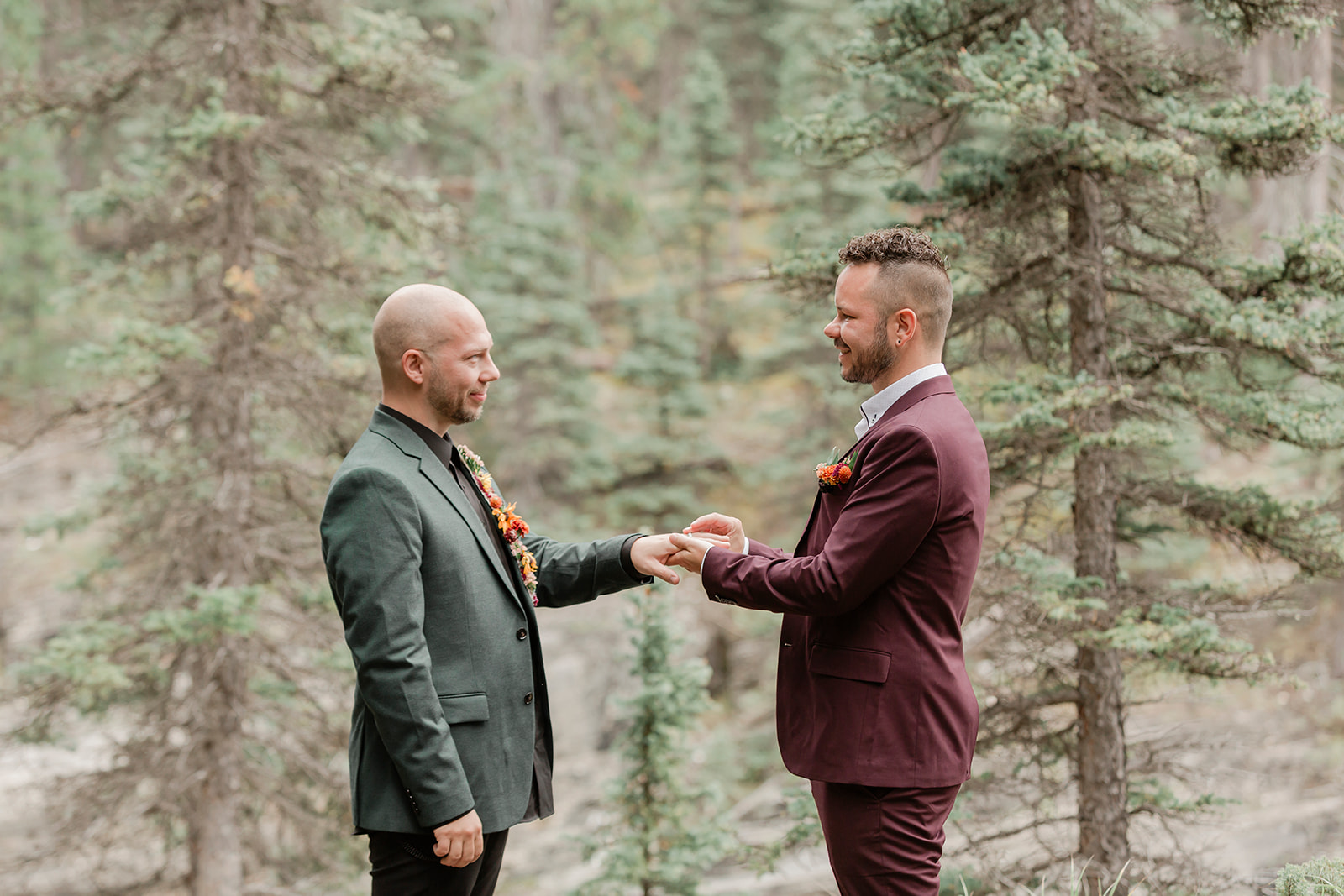 Brandon and Jamie exchanging rings in banff national park elopement