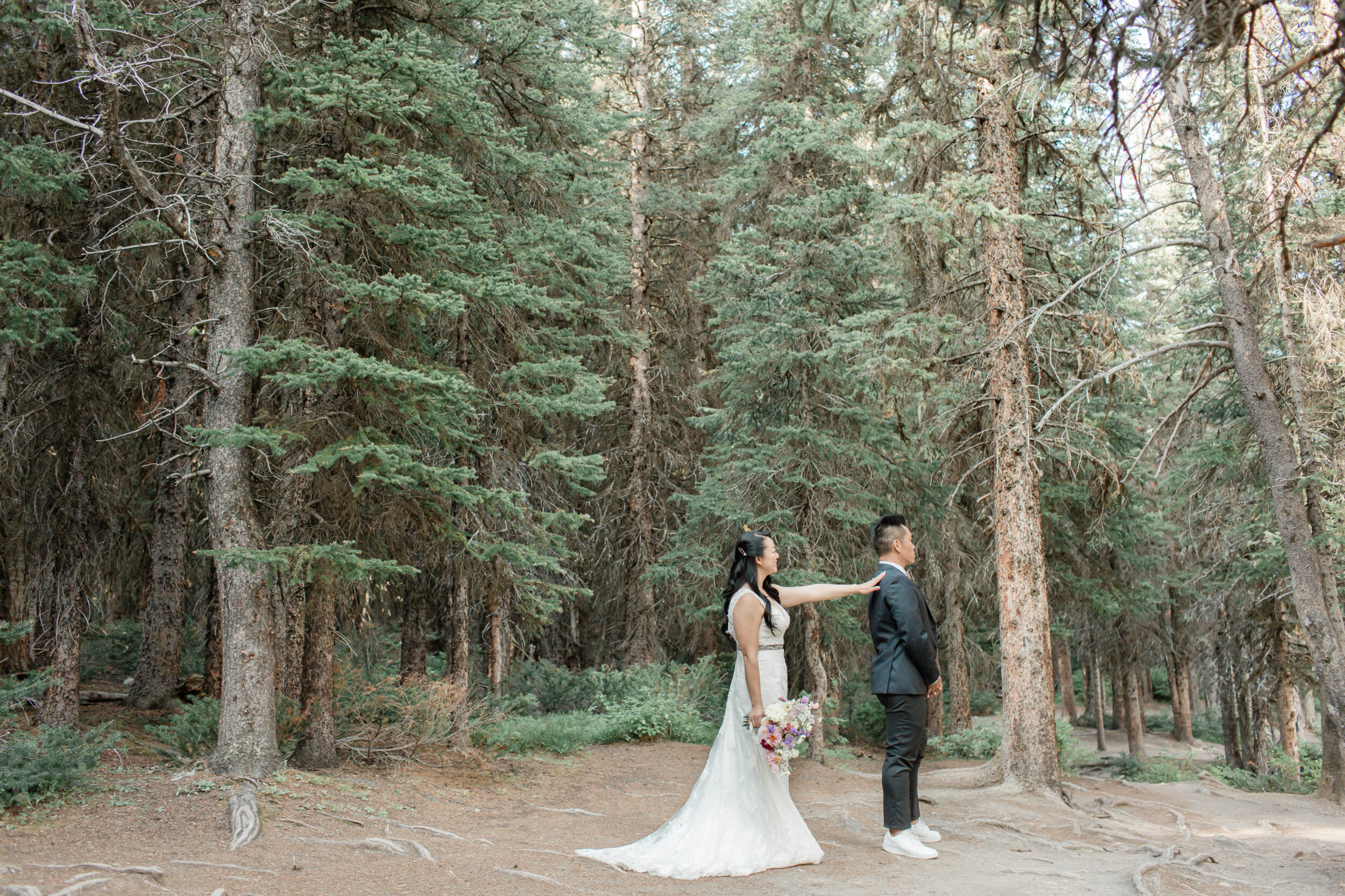 A couple shares a first look before their intimate Banff wedding.
