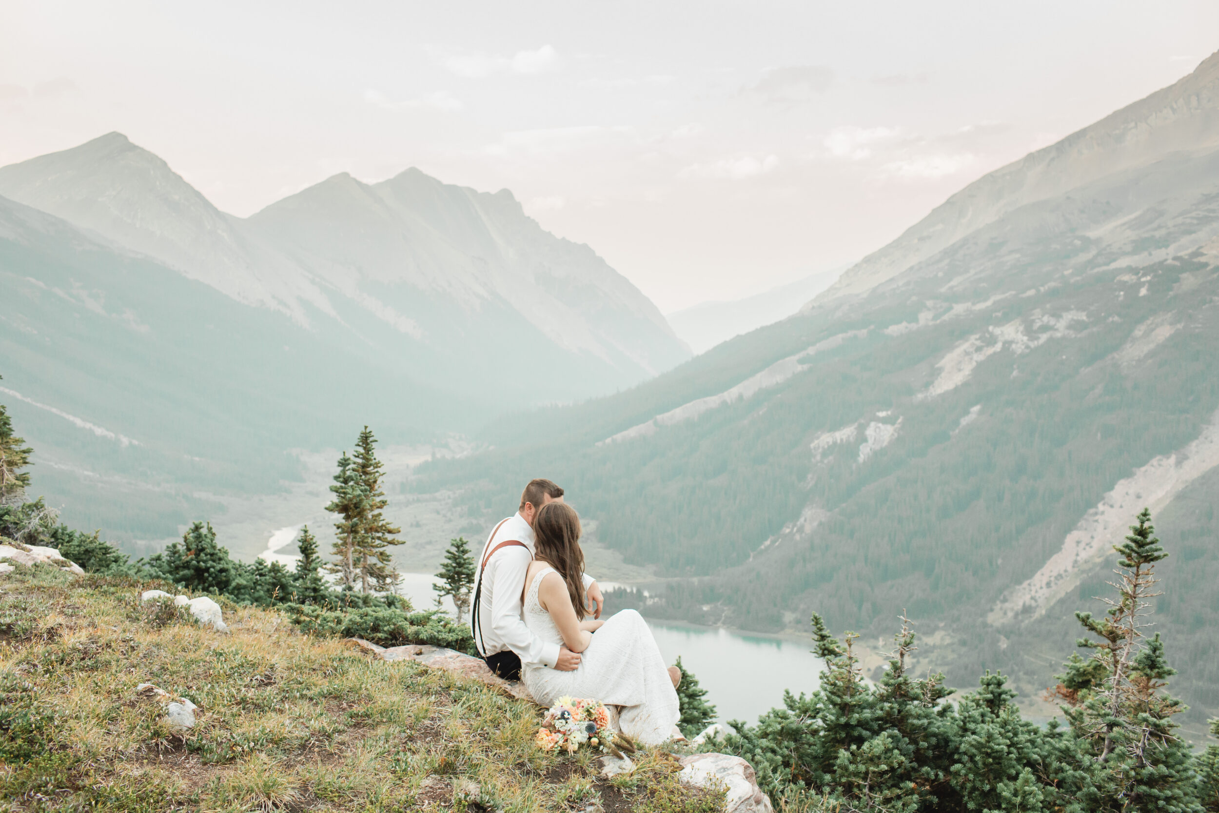 A couple enjoys the view after their Banff elopement.
