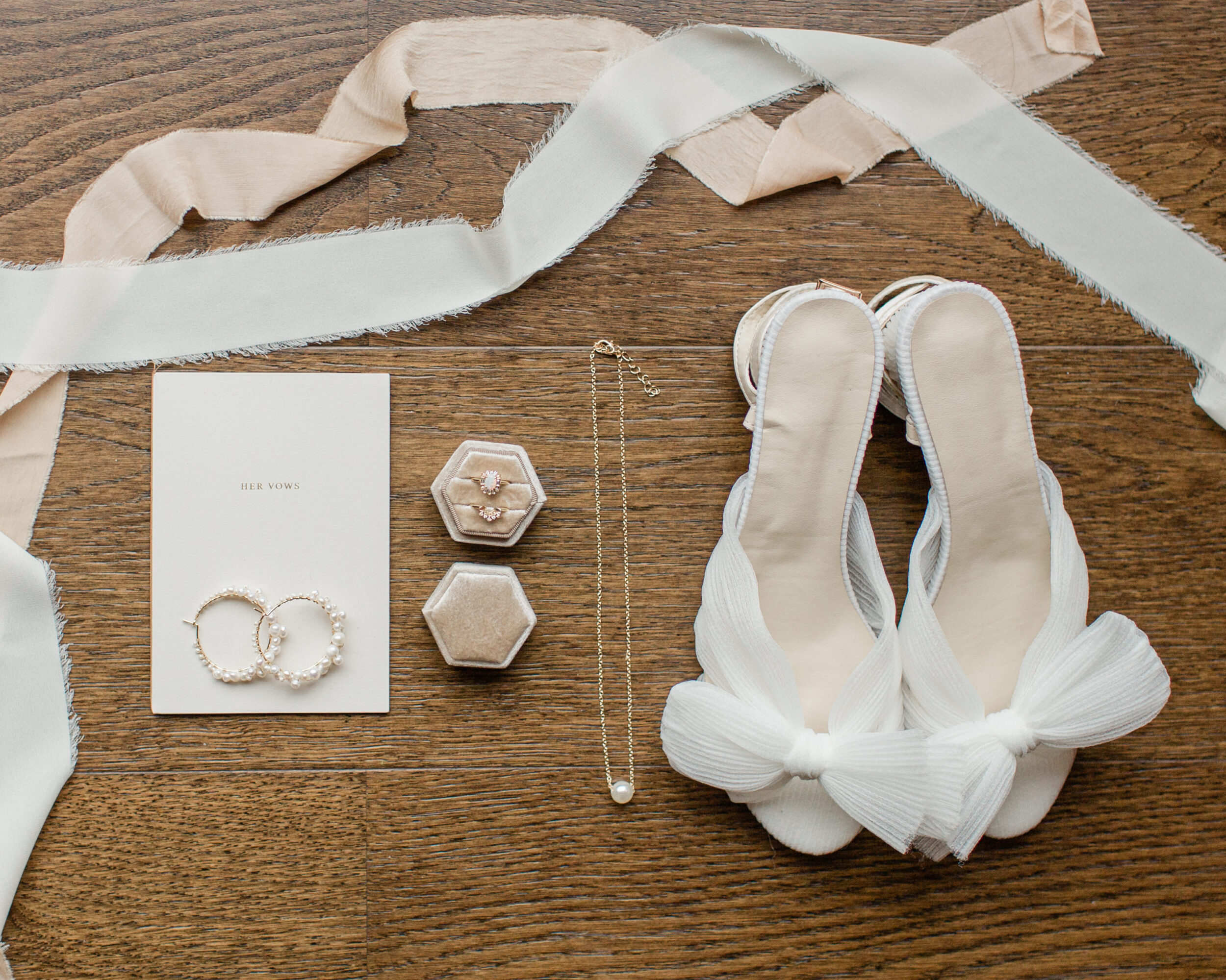 Detail shots of a bride's wedding jewelry and wedding shoes. 
