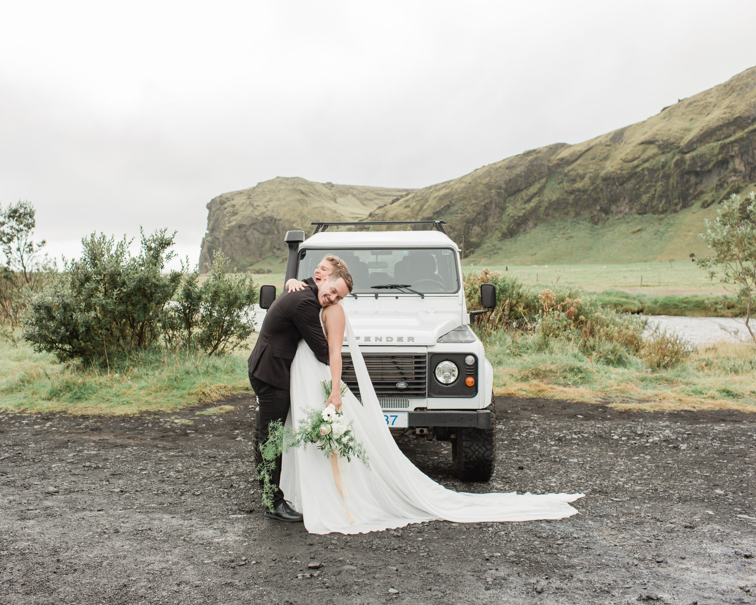A man rests his head on the love of his life's shoulder before their small Iceland wedding. 