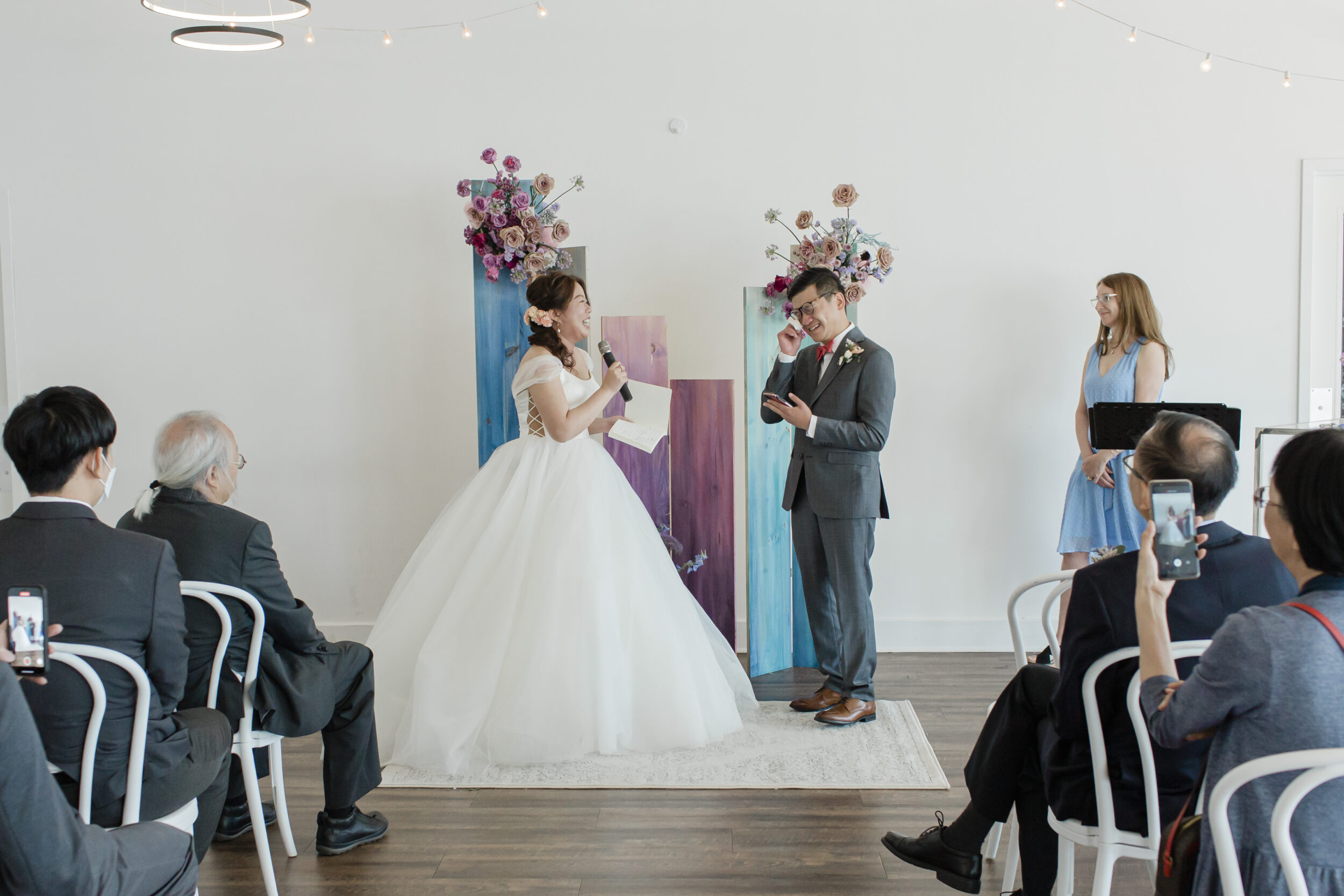 A couple shares emotional vows at an art gallery elopement in Toronto. 