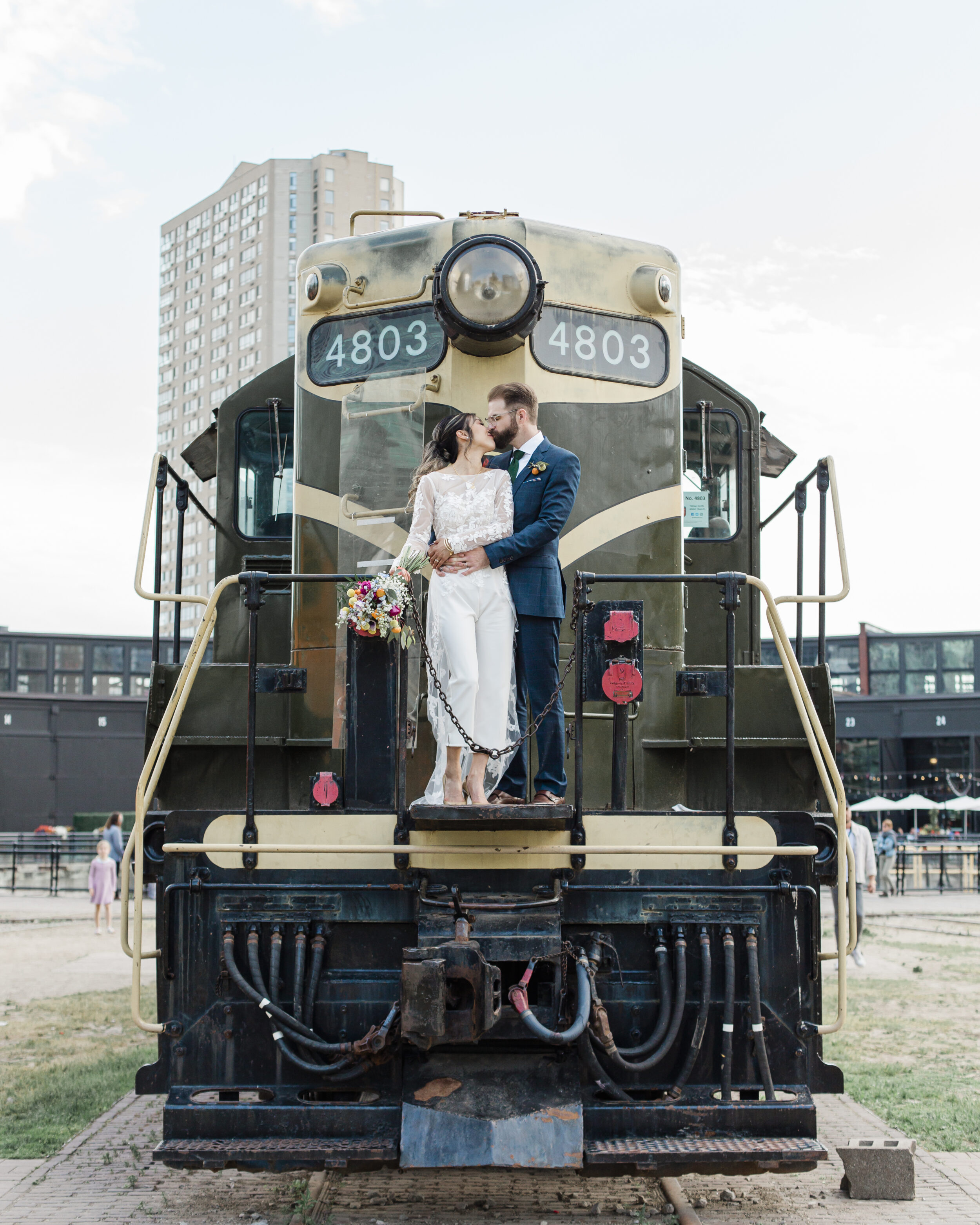 A couple kisses on a train in Downtown Toronto. 