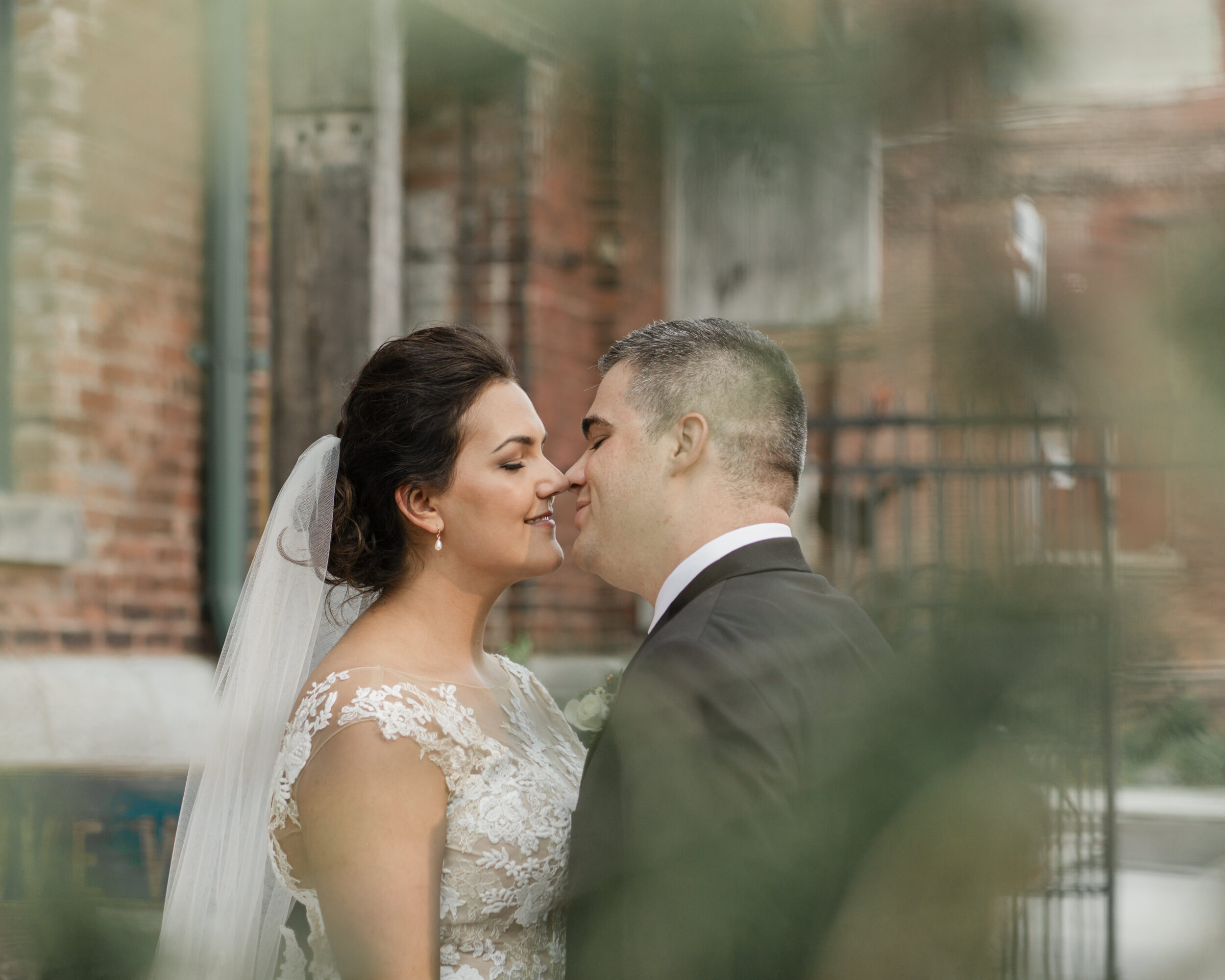 A woman and her groom kiss on the streets of Toronto. 