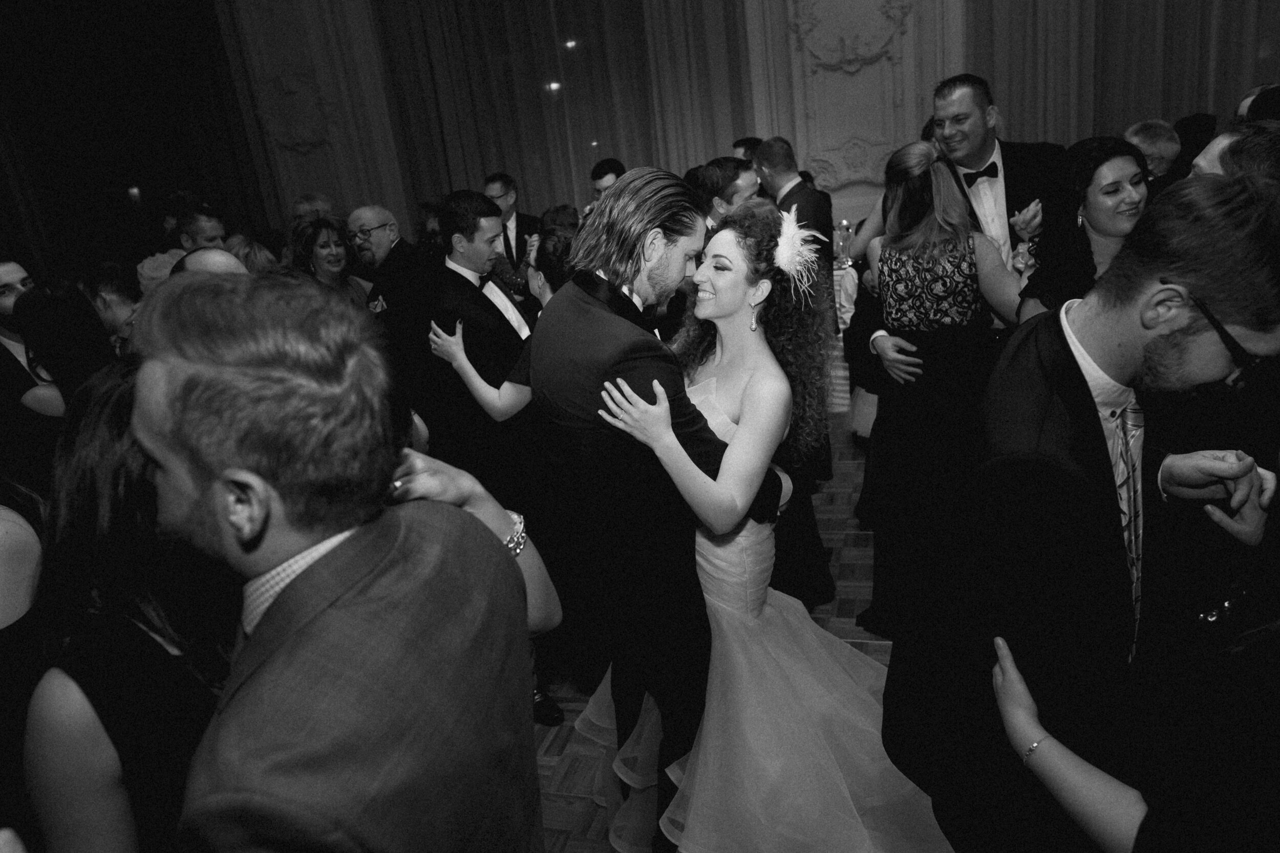 A newly married couple dances with one another at their reception in Toronto.