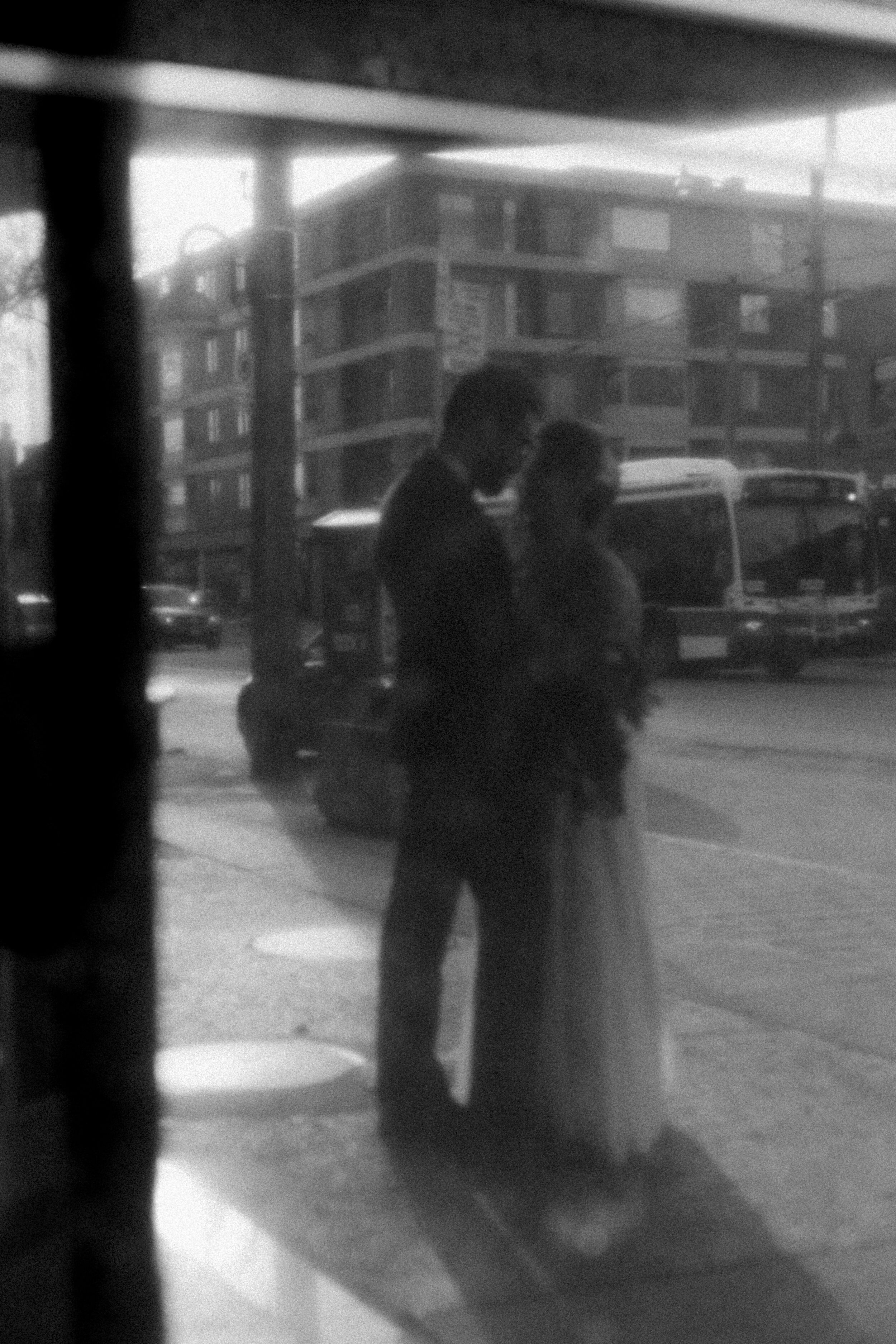 A couple embraces during their wedding on the streets of Toronto.