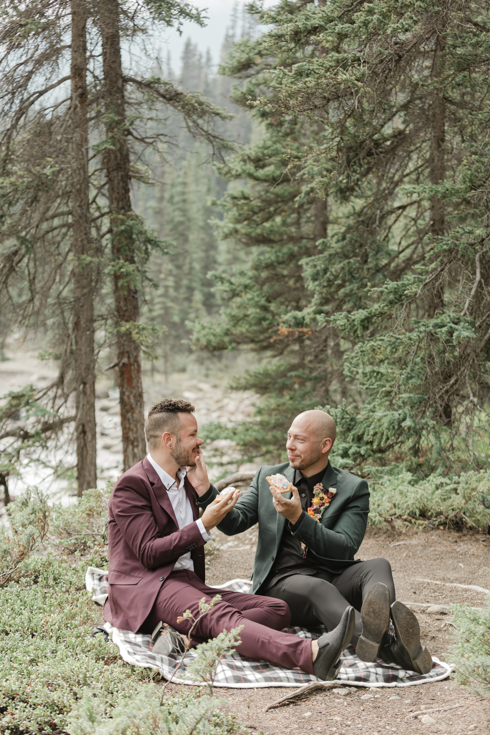Brandon and Jamie eating pop tarts together after their Banff elopement 