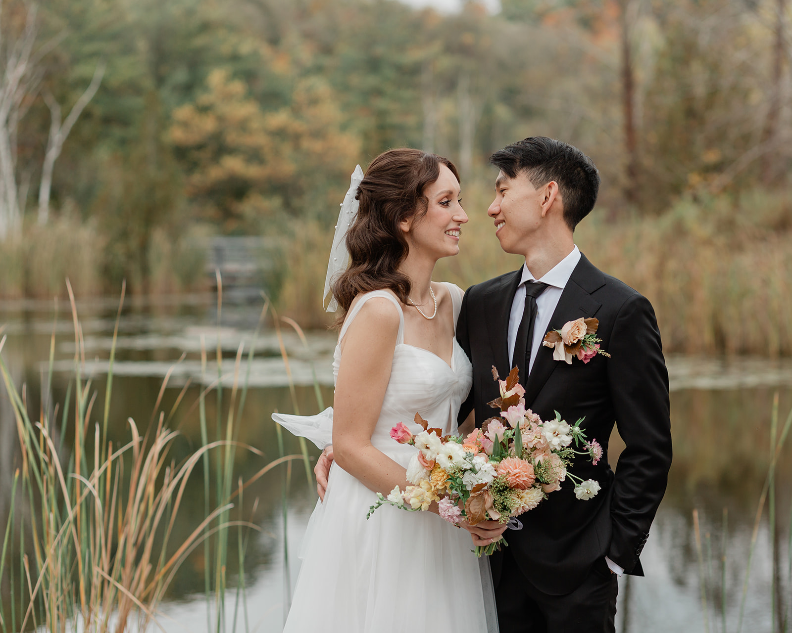 A couple looking at each other after their Toronto wedding at Evergreen Brick Works 