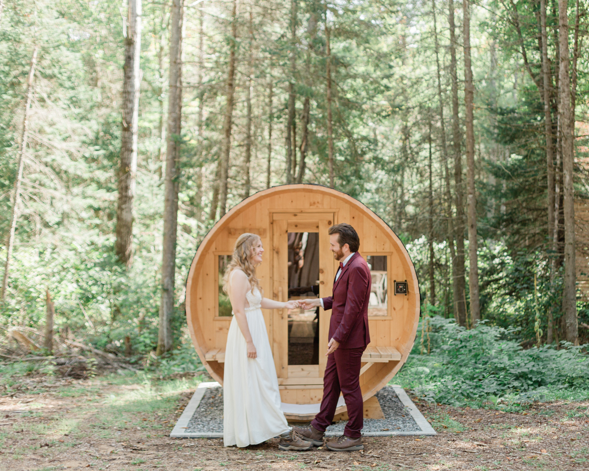 Chelsea and Kevin's first look in front of the sauna at their airbnb in Harcourt Ontario for their elopement day 