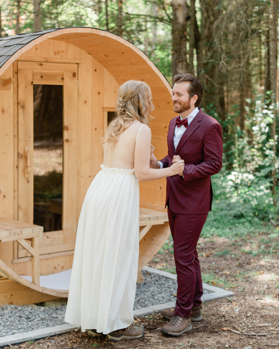 Chelsea and Kevin's first look in front of the sauna at their airbnb in Harcourt Ontario for their elopement day 