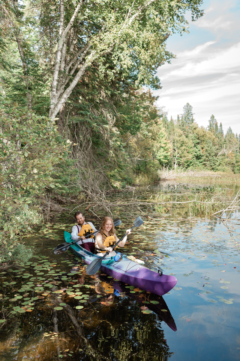 A couple kayaking on a private lake during their Algonquin Park elopement 