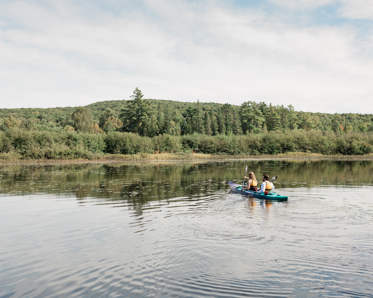 Enjoying a chill kayak ride along the Barron river for their Algonquin Park Elopement 