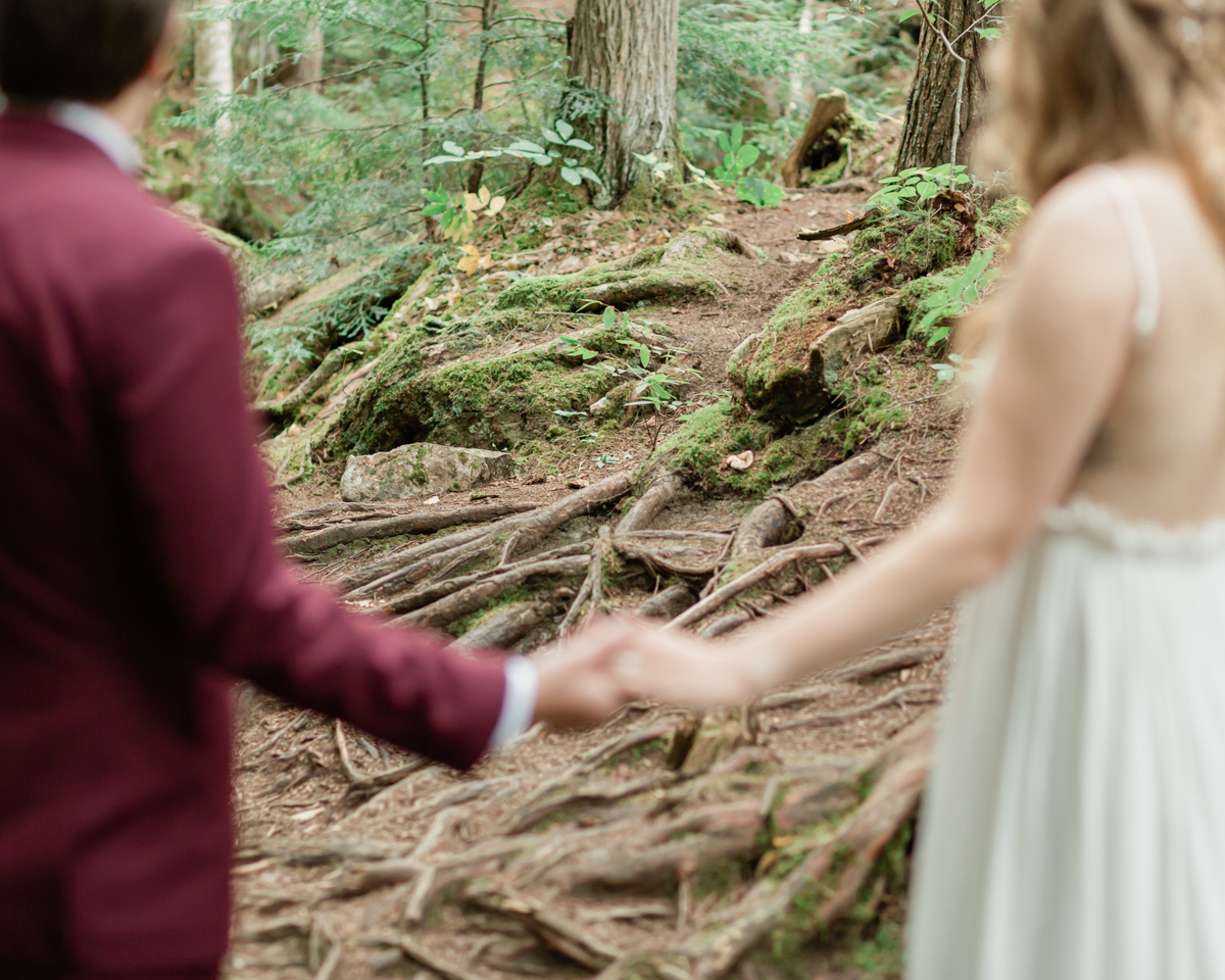 Kissing on the High Falls trail for Chelsea and Kevin's Algonquin Park elopement 