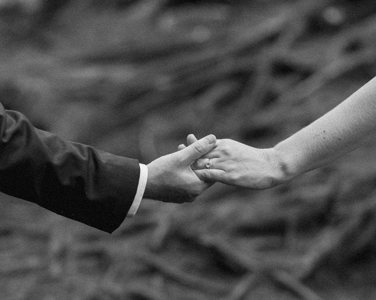 Kissing on the High Falls trail for Chelsea and Kevin's Algonquin Park elopement 