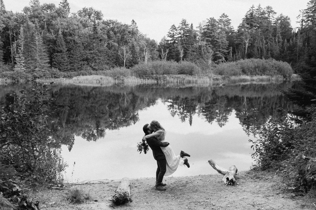 Kissing on the High Falls trail for Chelsea and Kevin's Algonquin Park elopement 