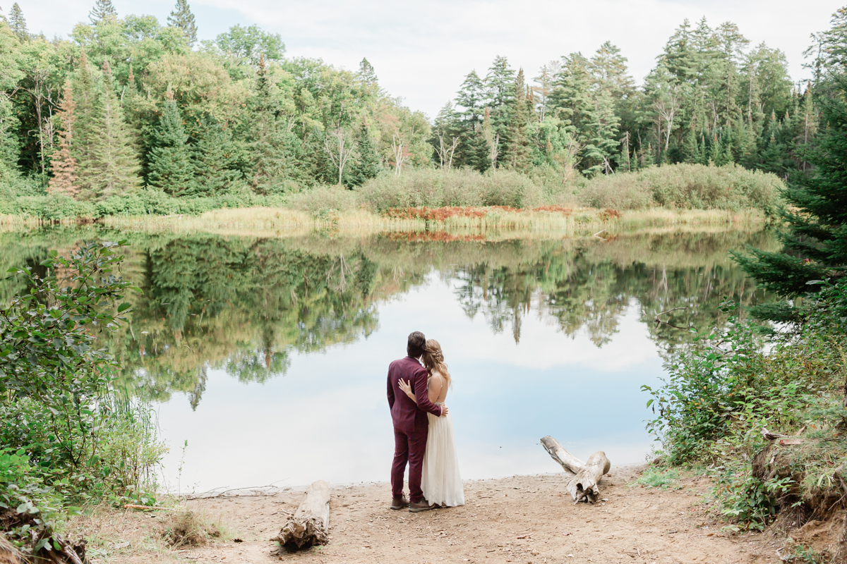 Kissing on the High Falls trail for Chelsea and Kevin's Algonquin Park elopement 