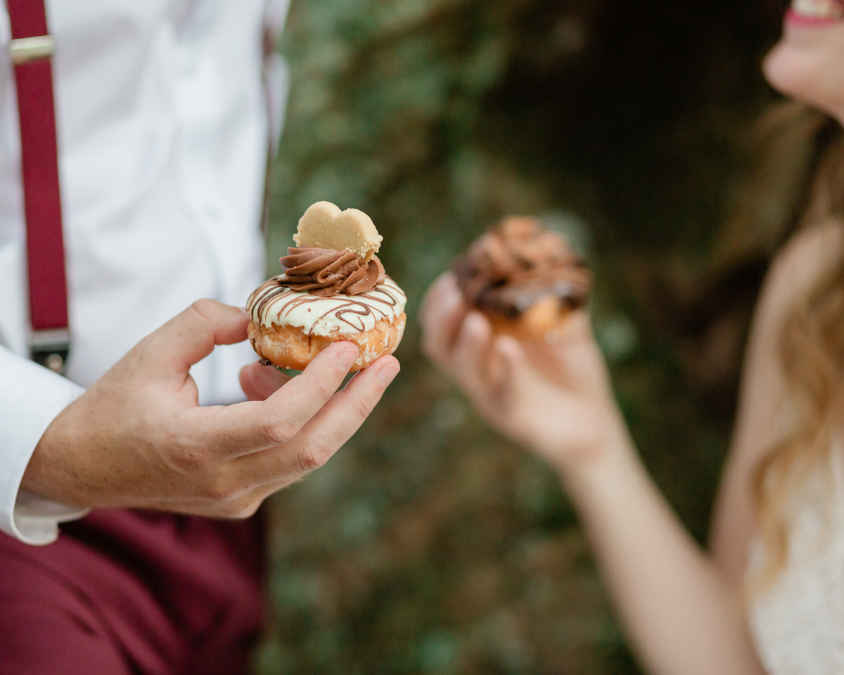 Eating delicious peanut free cupcakes in front of a super cool mystical tree during their Algonquin Park elopement