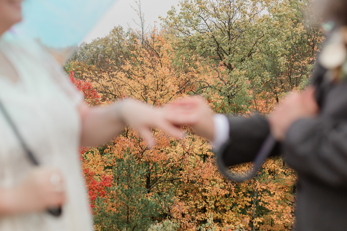 A couple exchanging rings on Manitoulin island during their wedding 