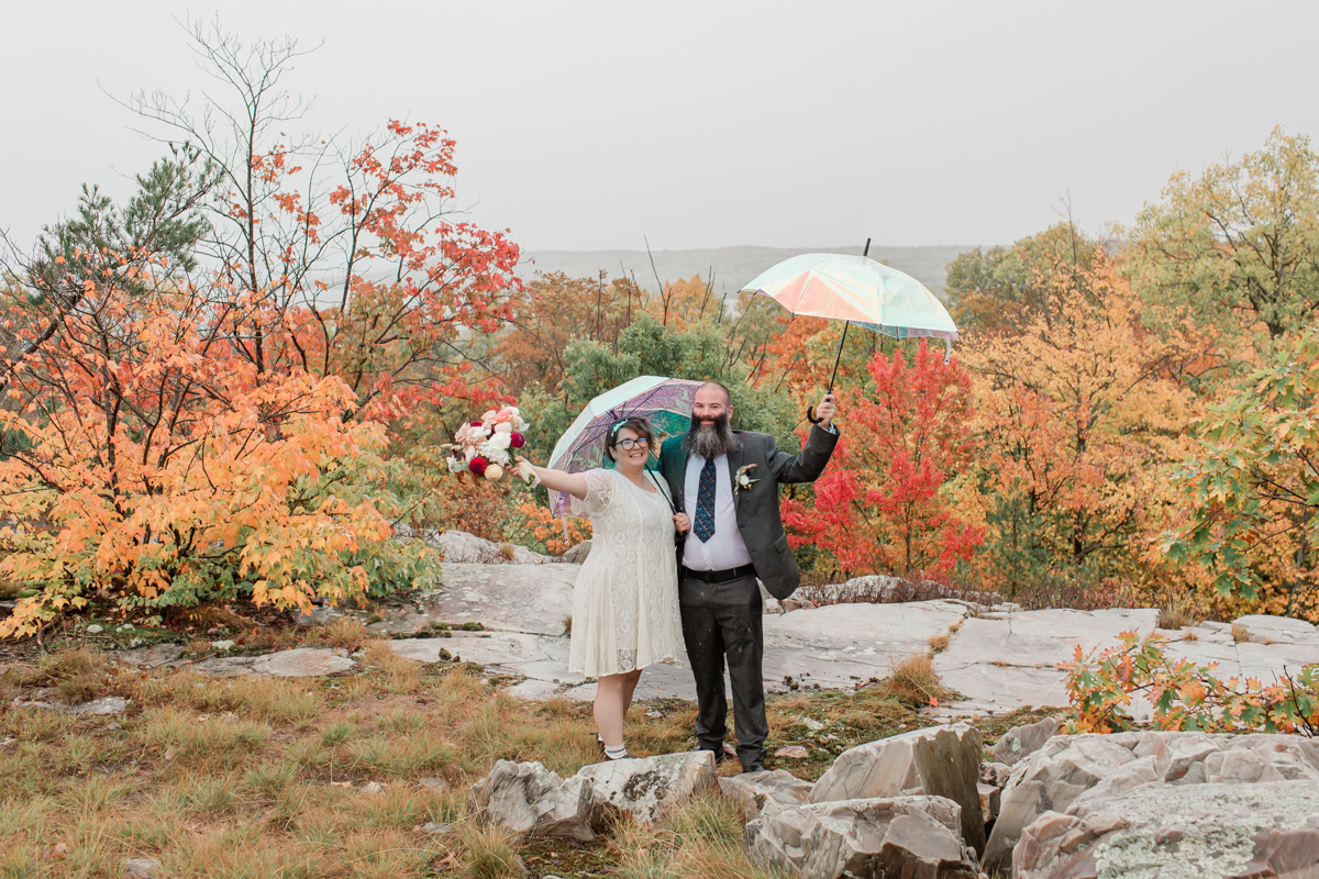 A couple celebrating post vows while hiking on Manitoulin island during their wedding 
