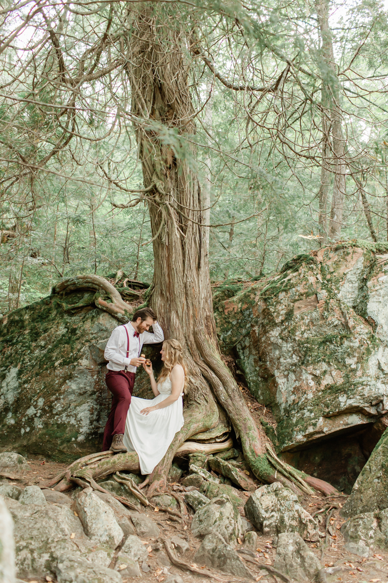 A couple enjoying donuts during their Algonquin Park elopement 