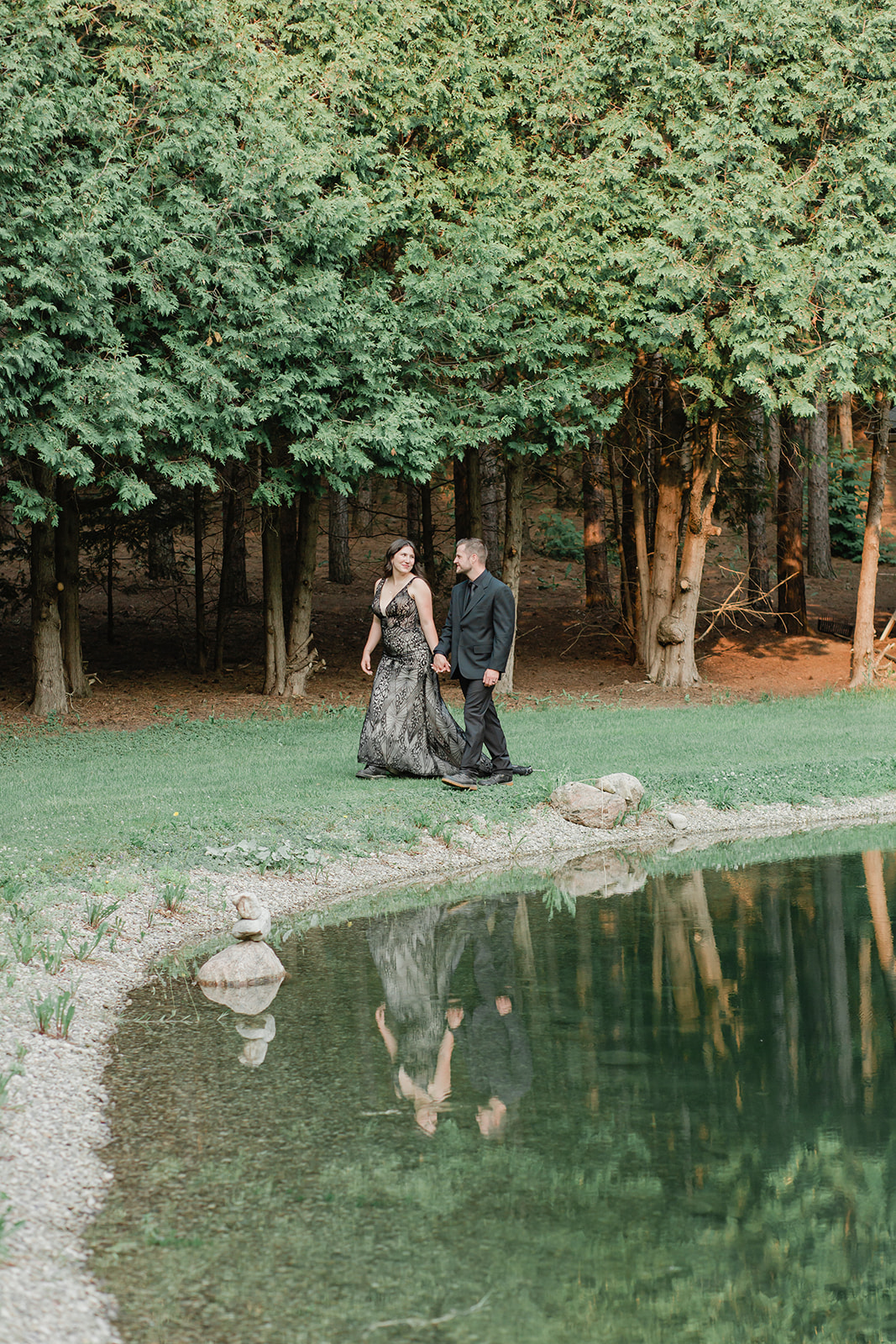 A wedding near Toronto Ontario at a cute cabin in the woods. After their ceremony they had their first dance by a private pond on the water. 
