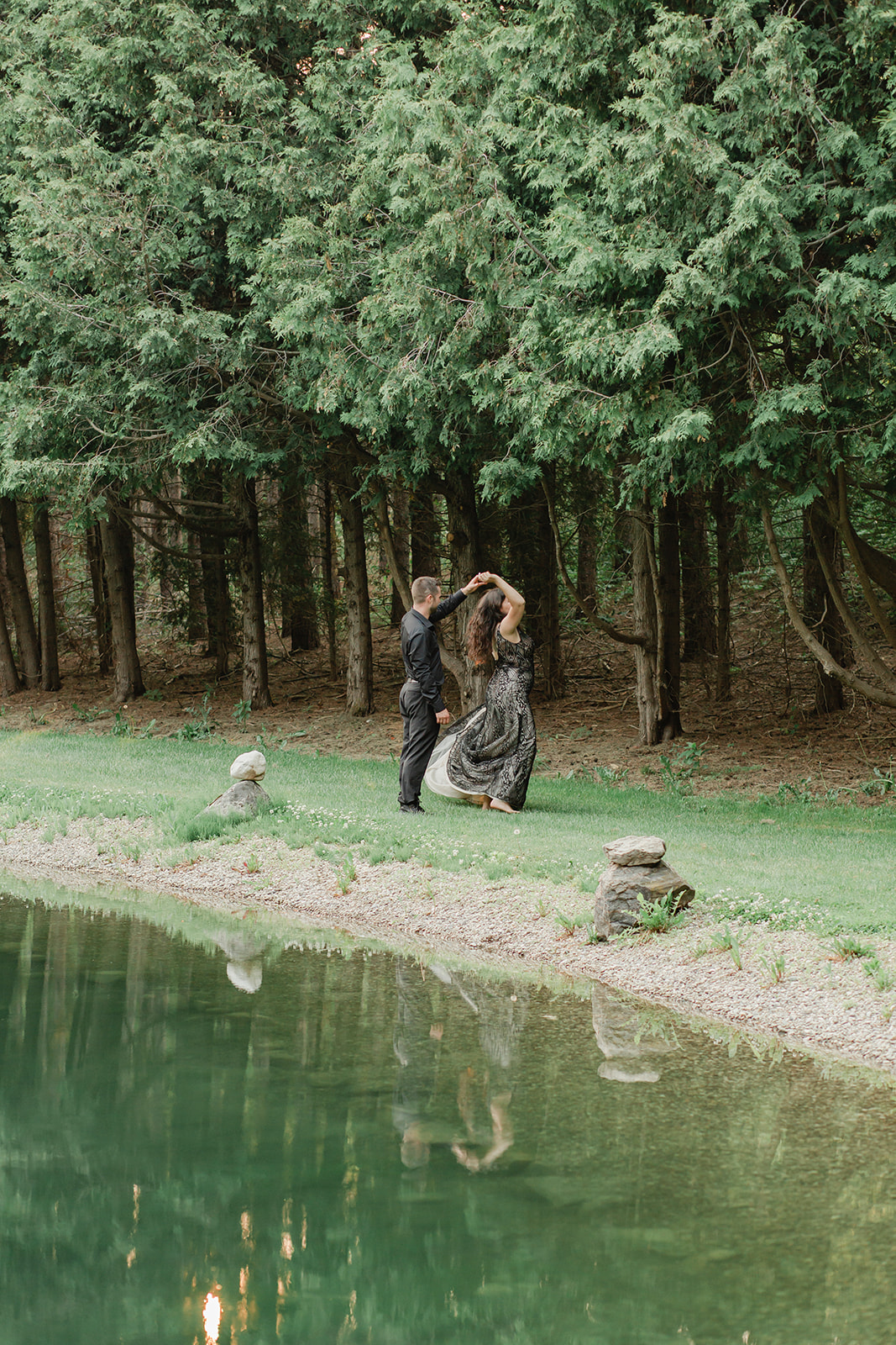 A wedding near Toronto Ontario at a cute cabin in the woods. After their ceremony they had their first dance by a private pond on the water. 