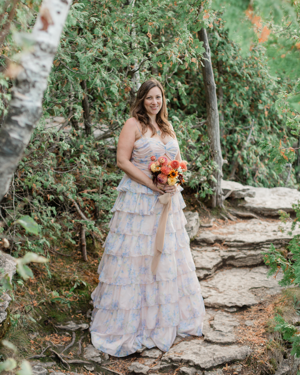 Katie and John walk towards the Grotto and Indian Head Cove for their Ontario wedding