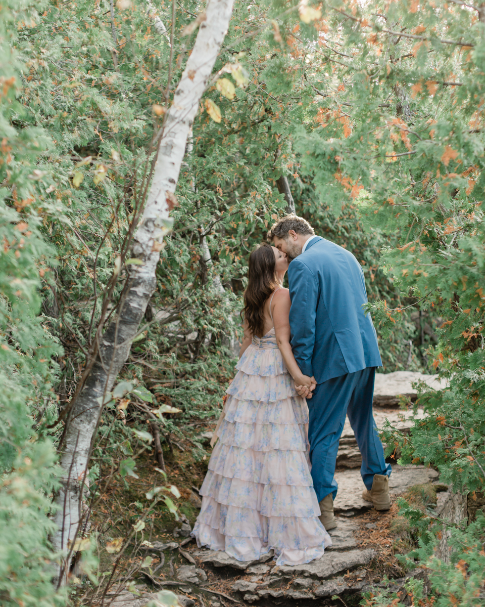 Katie and John walk towards the Grotto and Indian Head Cove for their Ontario wedding
