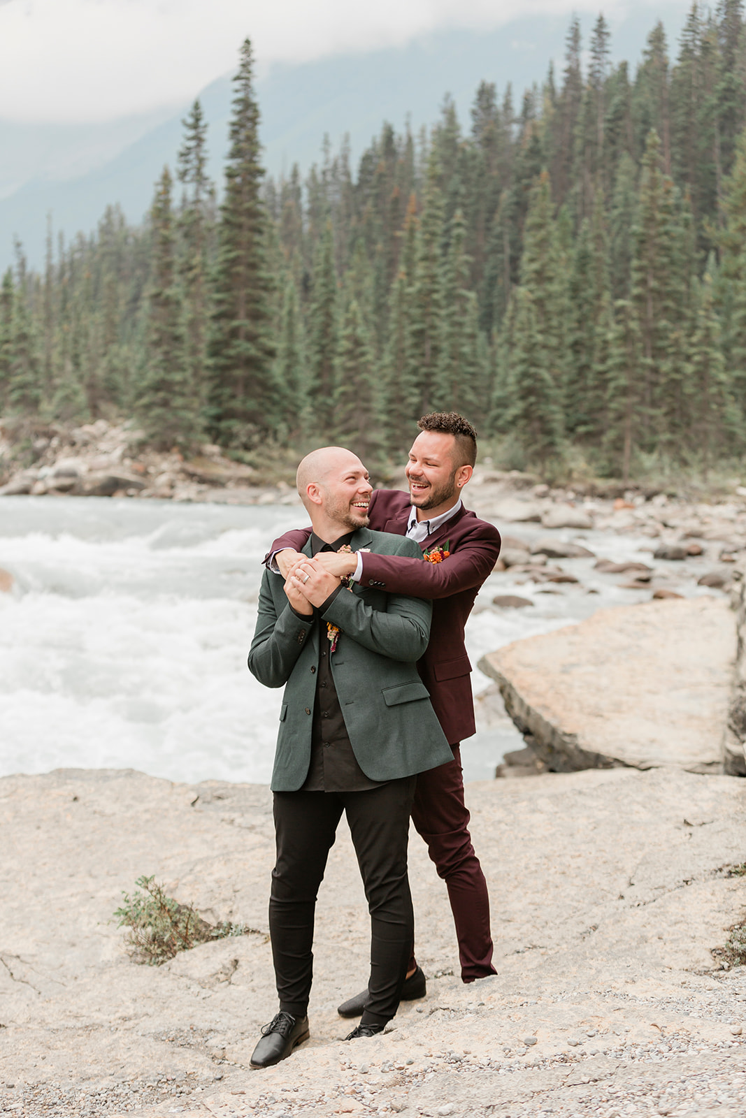 A Mistaya Canyon elopement couple hugs one another. 