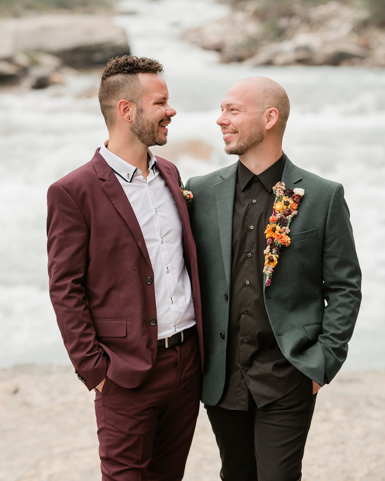 A Mistaya Canyon elopement couple admires one another during a wedding portrait. 