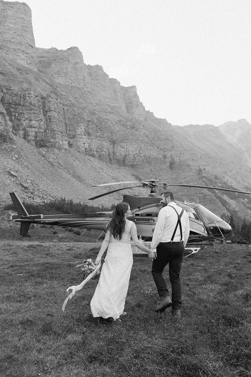 An Alberta wedding couple celebrates a Banff helicopter elopement in the national park with RockiesHeli.