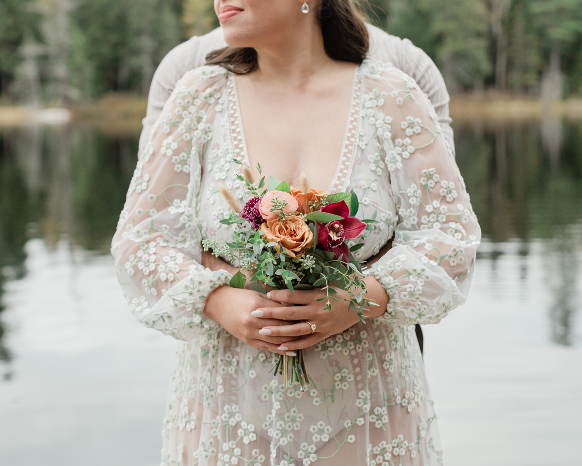 A couple laughing and embracing on a Muskoka doc post elopement 