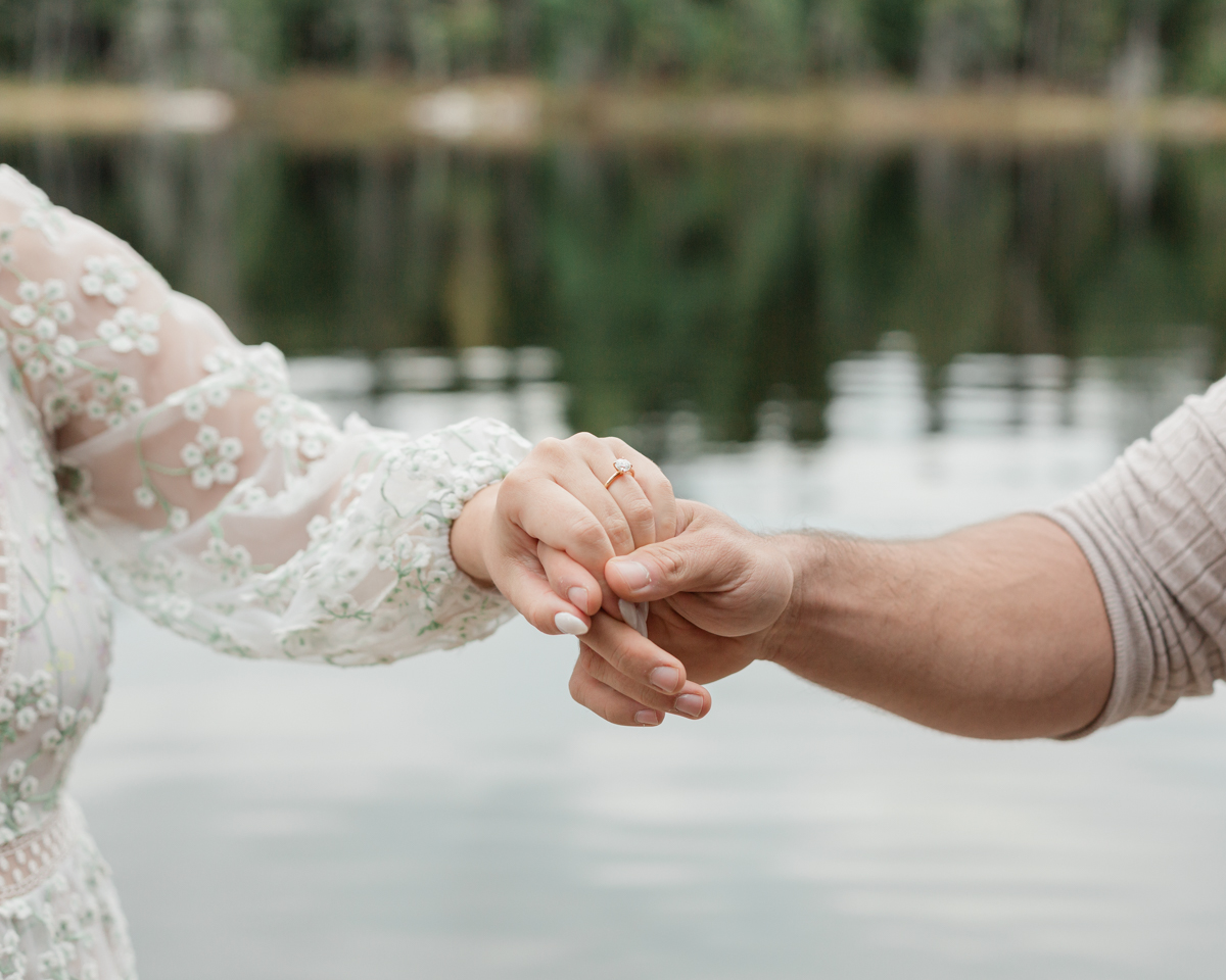 A couple laughing and embracing on a Muskoka doc post elopement 