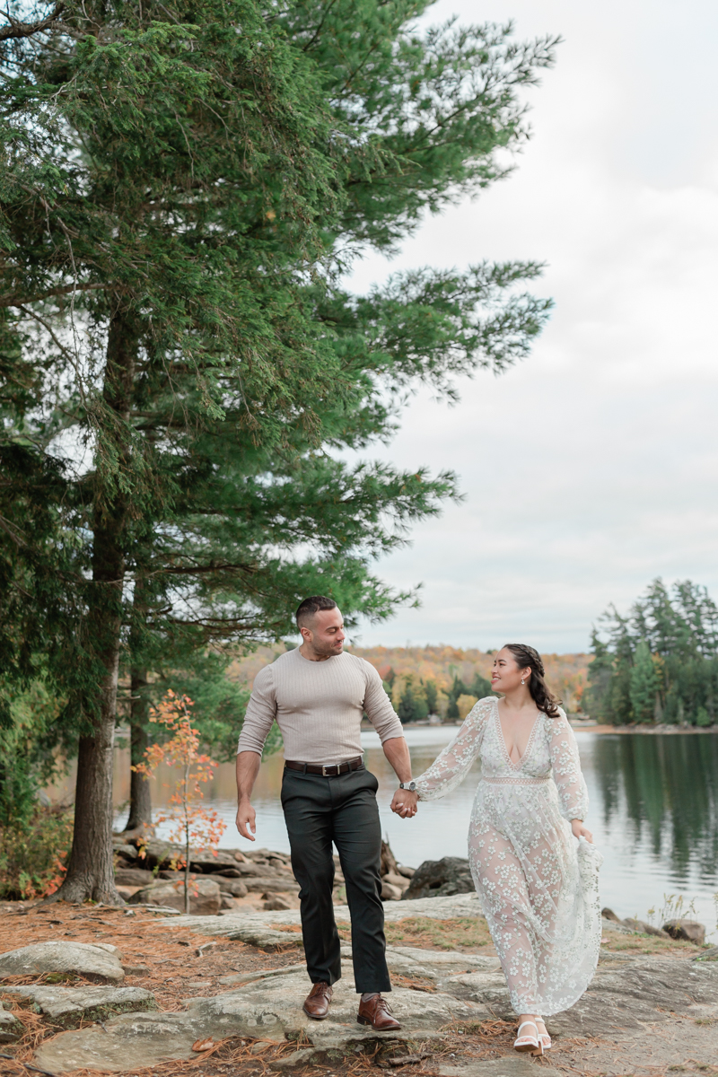 A couple kissing on a Muskoka lakefront after their wedding 