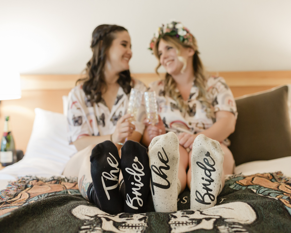 Lauren and Amber have a serenade dance party at their Moraine Lake Lodge accommodation for their Banff National Park Elopement