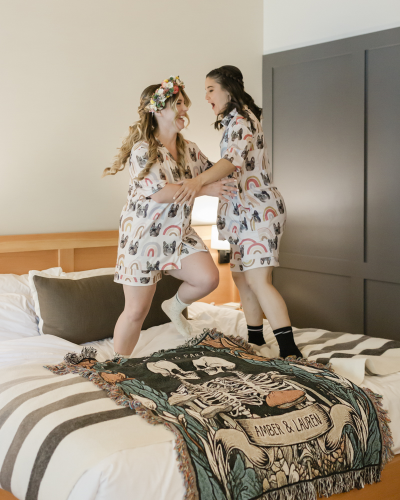 Lauren and Amber have a serenade dance party at their Moraine Lake Lodge accommodation for their Banff National Park Elopement