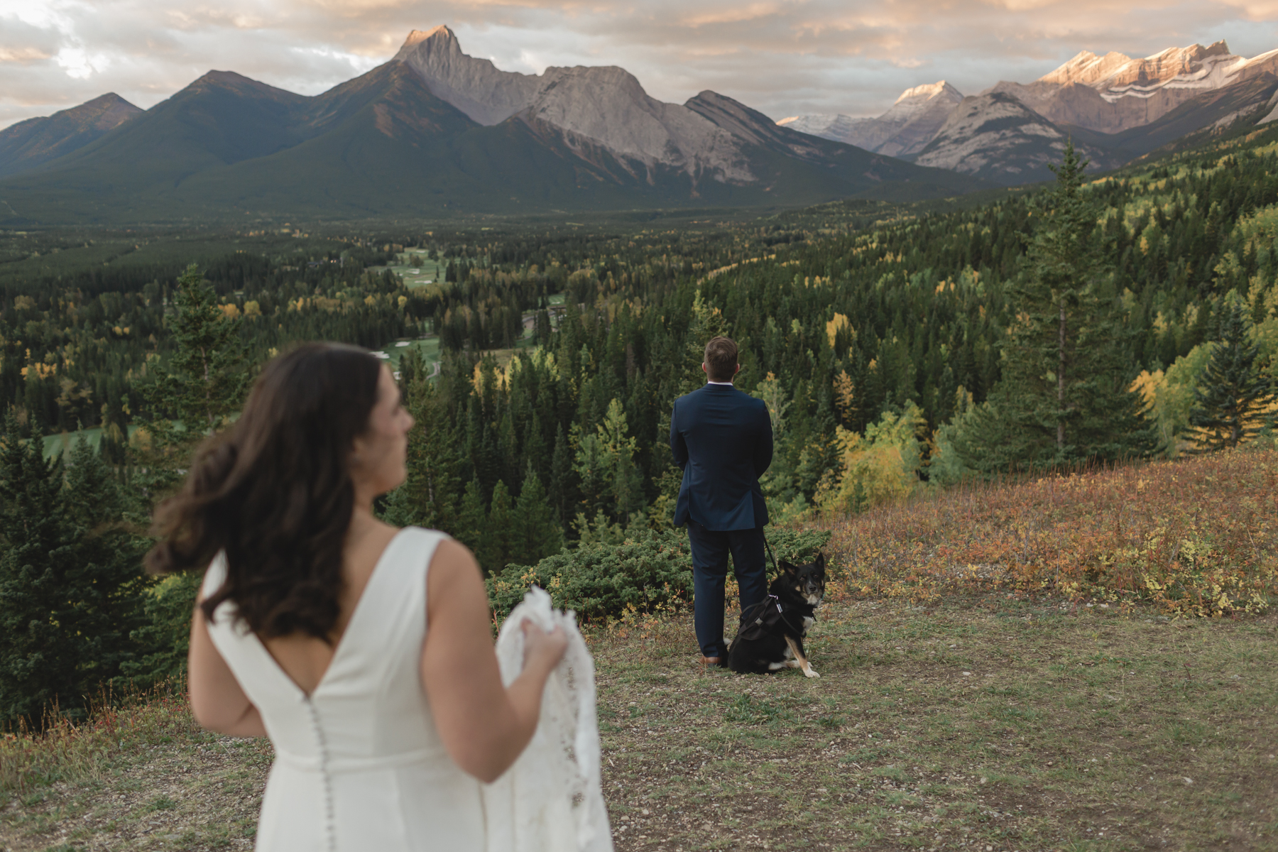 A couple having their first look at Kananaskis Mountain Lodge at sunrise