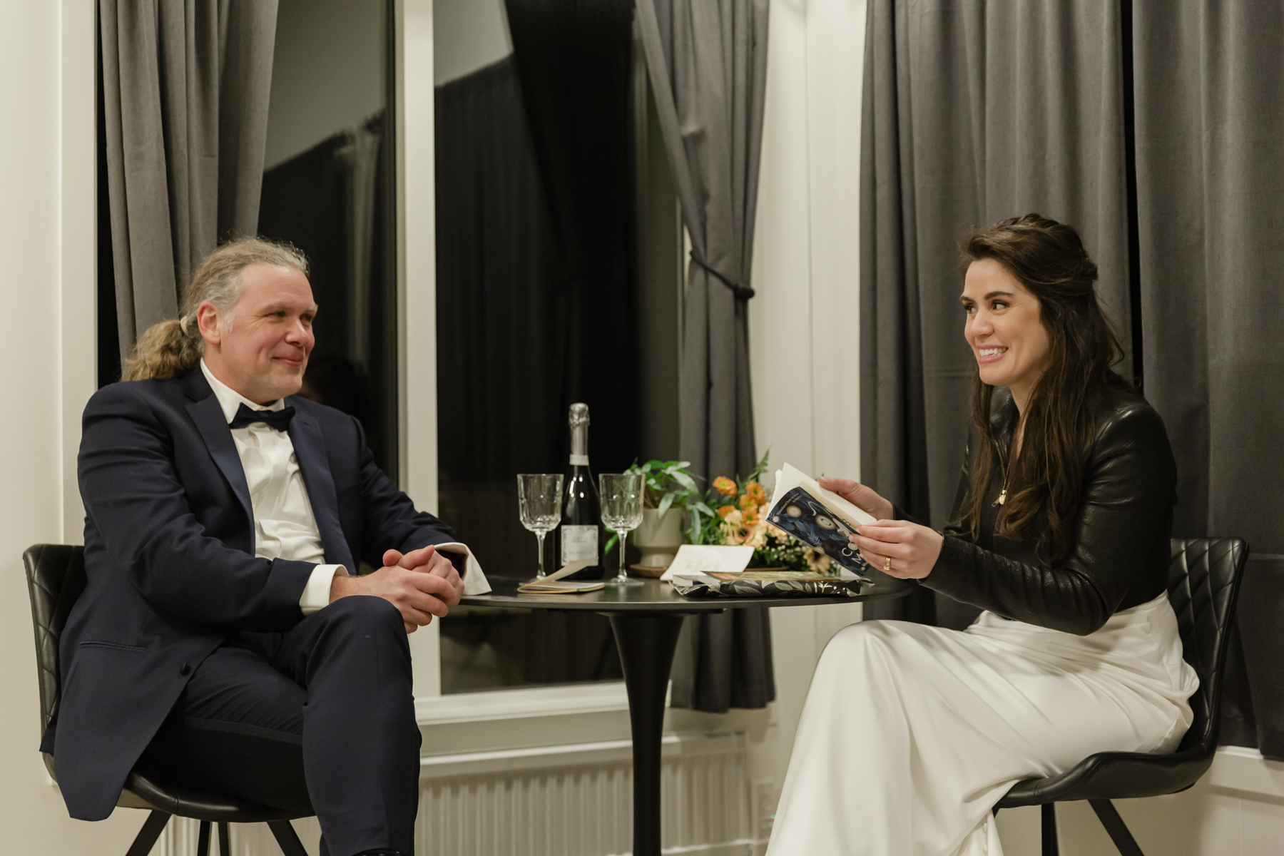 A couple exchanging gifts and celebrating with champagne in Iceland