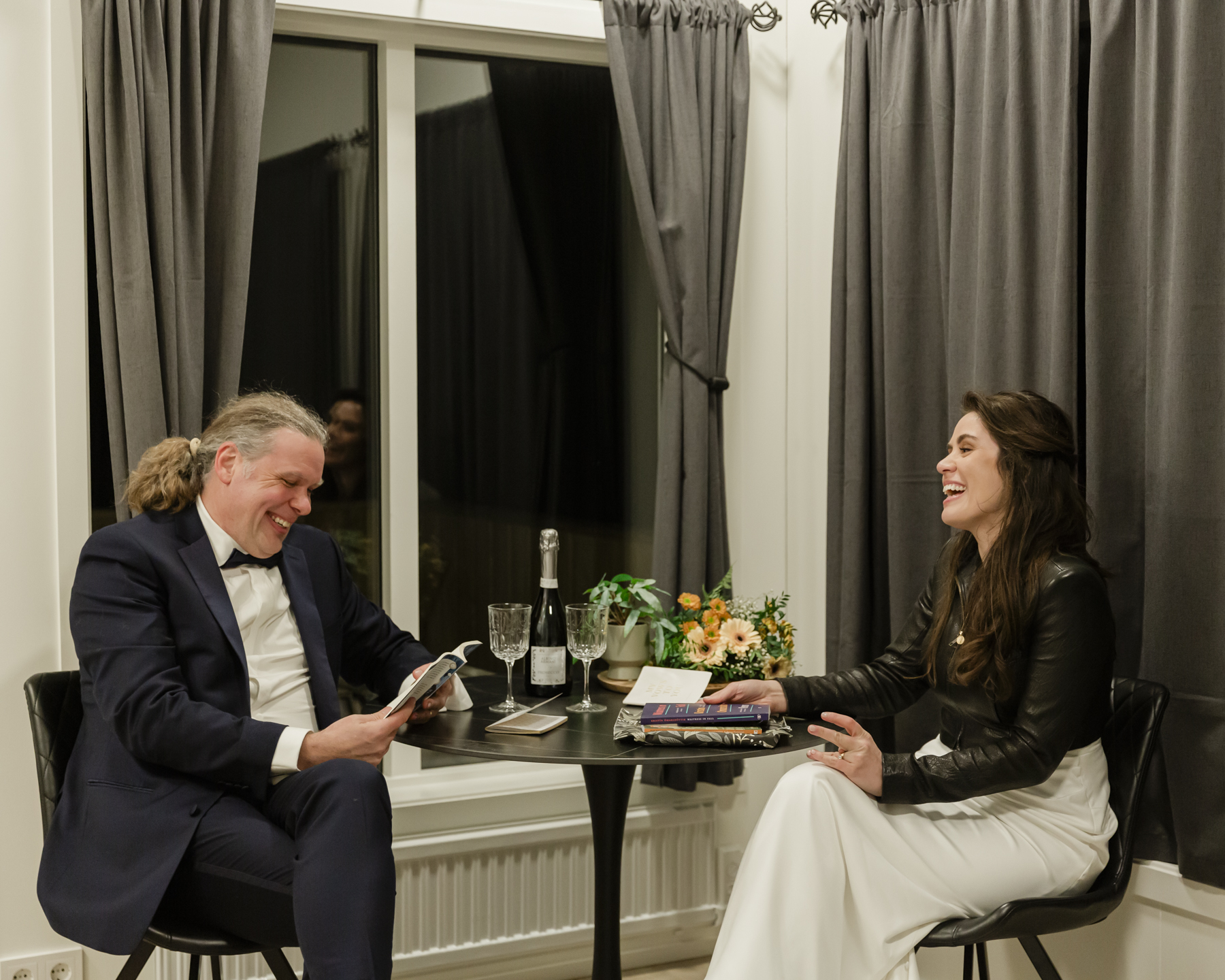 A couple exchanging gifts and celebrating with champagne in Iceland