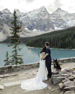 A looking at the mountains at Moraine Lake during their elopement 