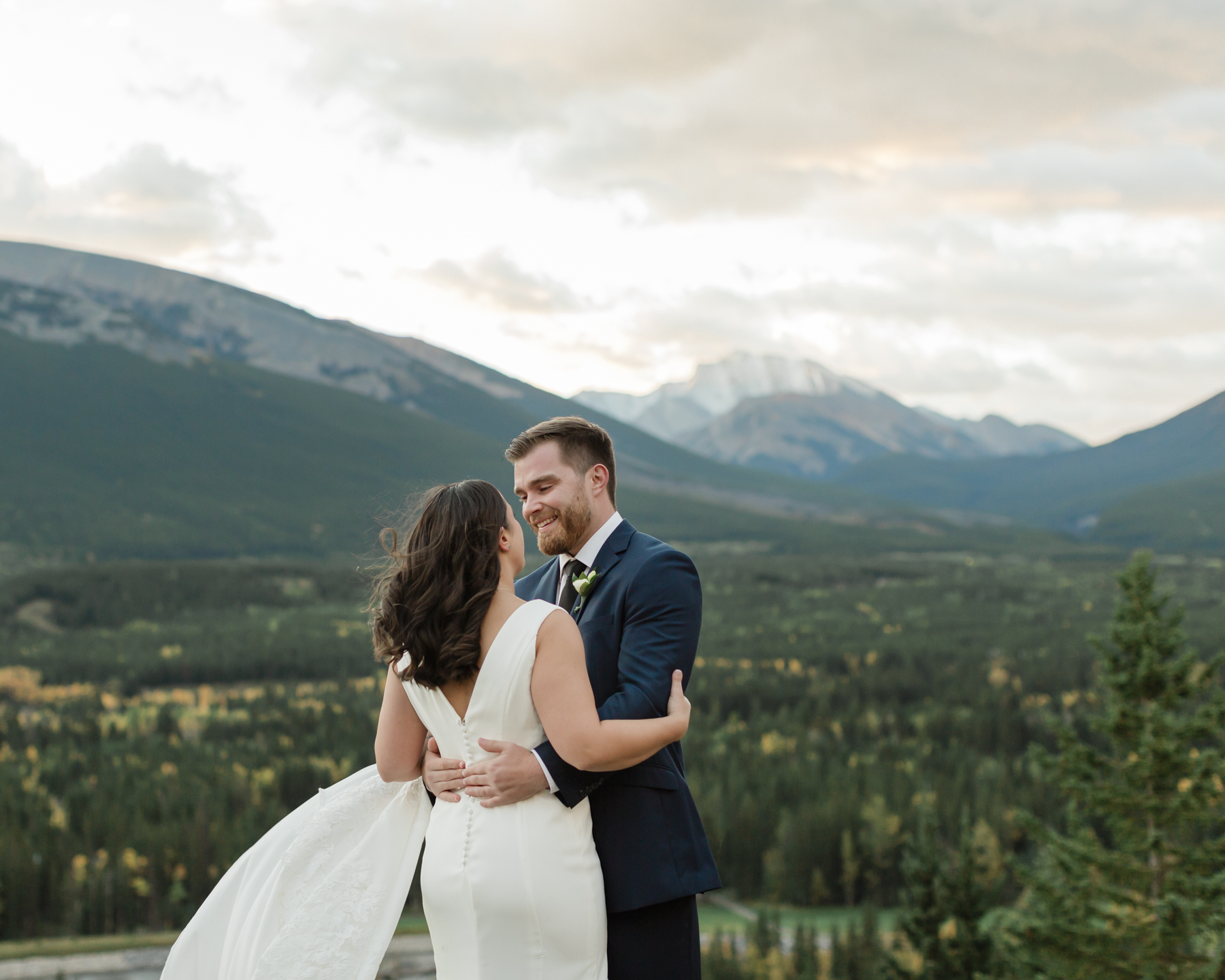 A couple having their first look at Kananaskis Mountain Lodge at sunrise