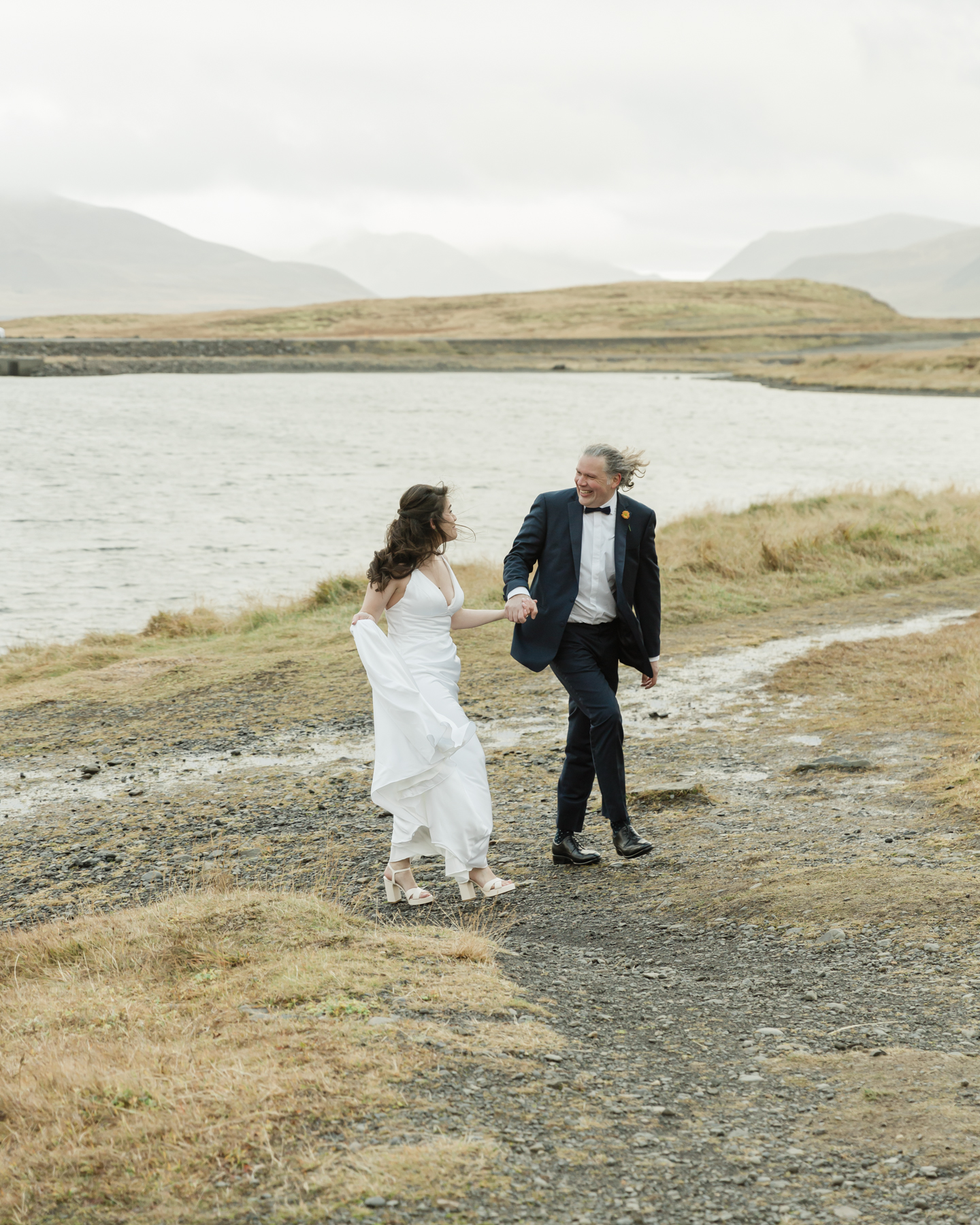 Kristen and Adam having their first look while facing Kirkjufell mountain in Iceland