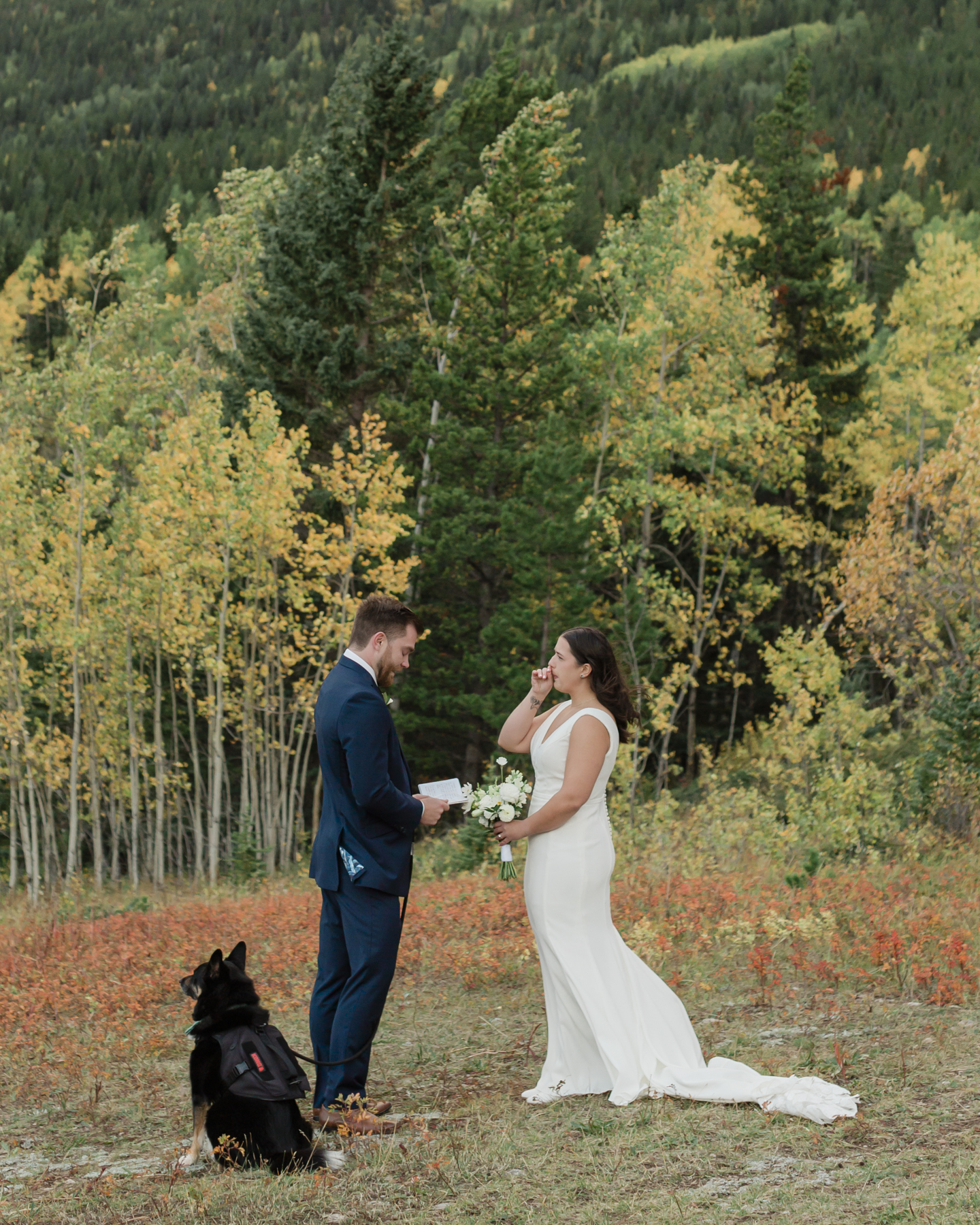 A couple exchanging vows and rings during their Kananaskis Country ceremony