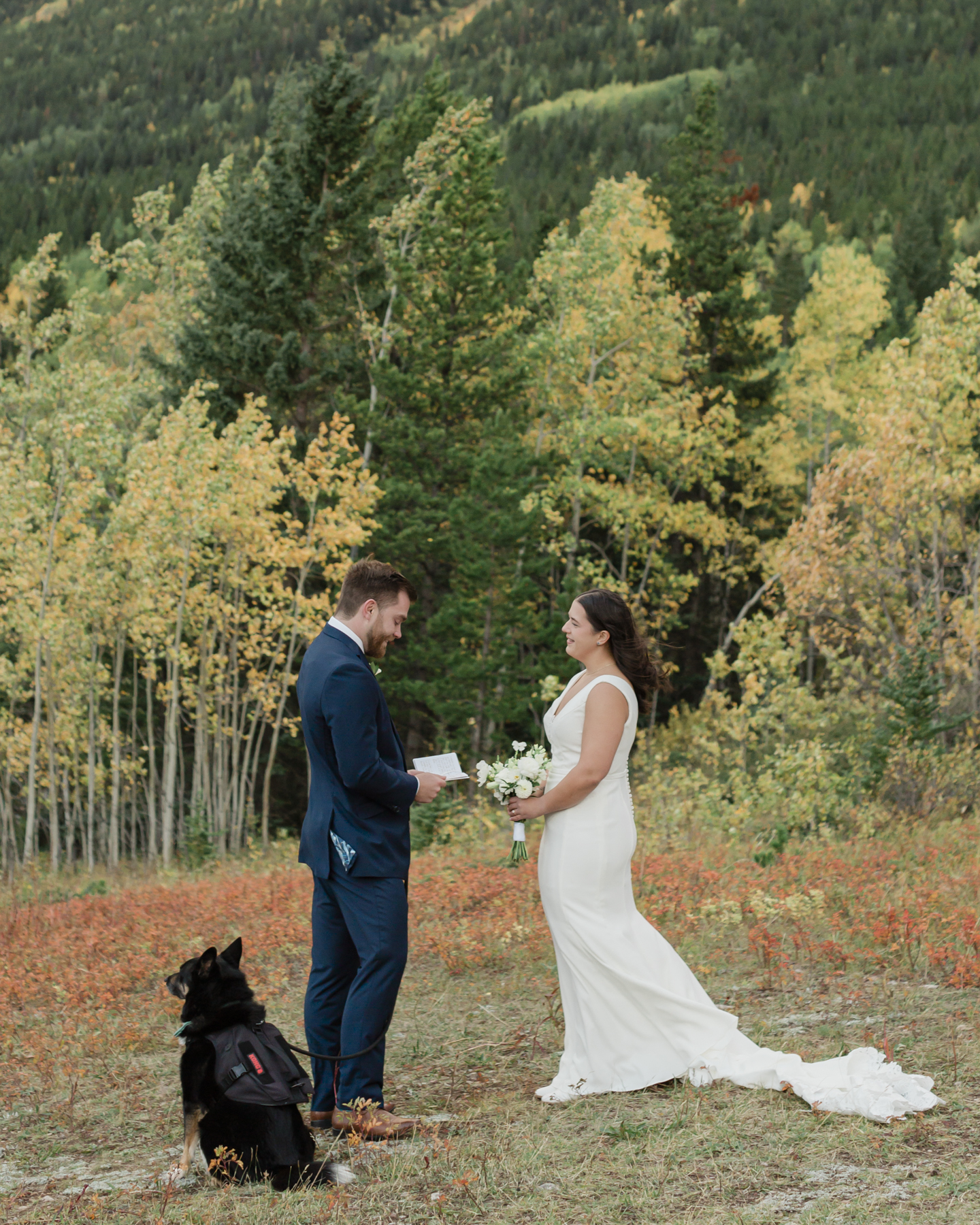 A couple exchanging vows and rings during their Kananaskis Country ceremony