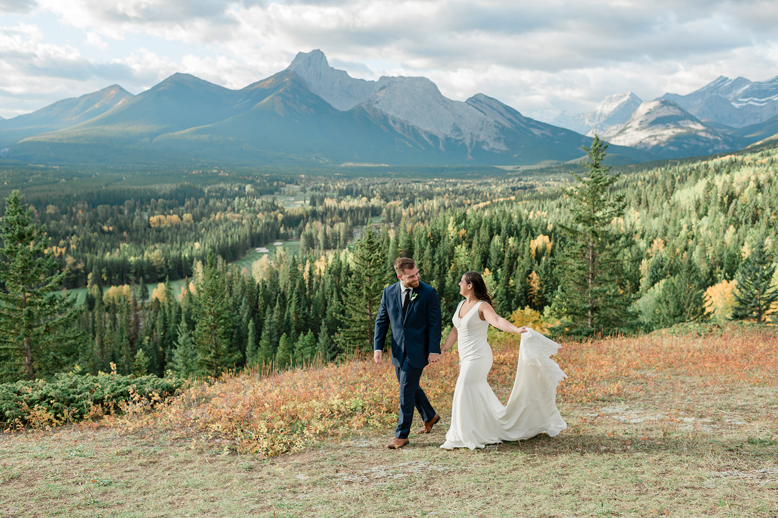 A couple walking along a kananaskis trail at the pomeroy mountain lodge