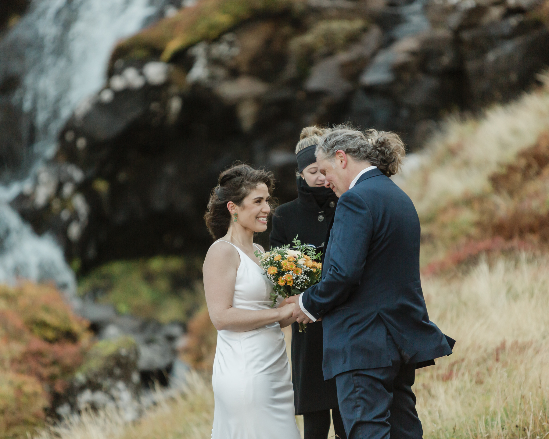 A couple eloping near a secluded waterfall in Iceland